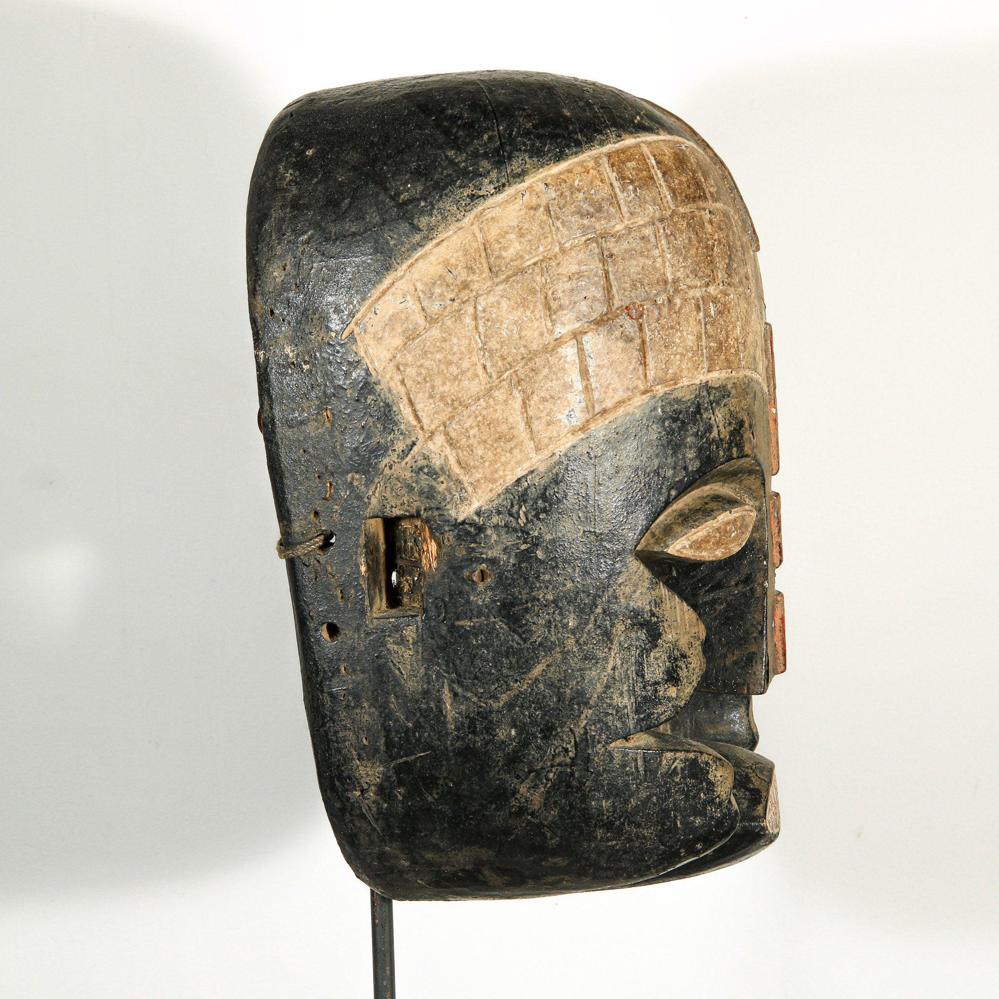 Bozo Puppet Mask from Mali on a stand as a home decor idea showing right side