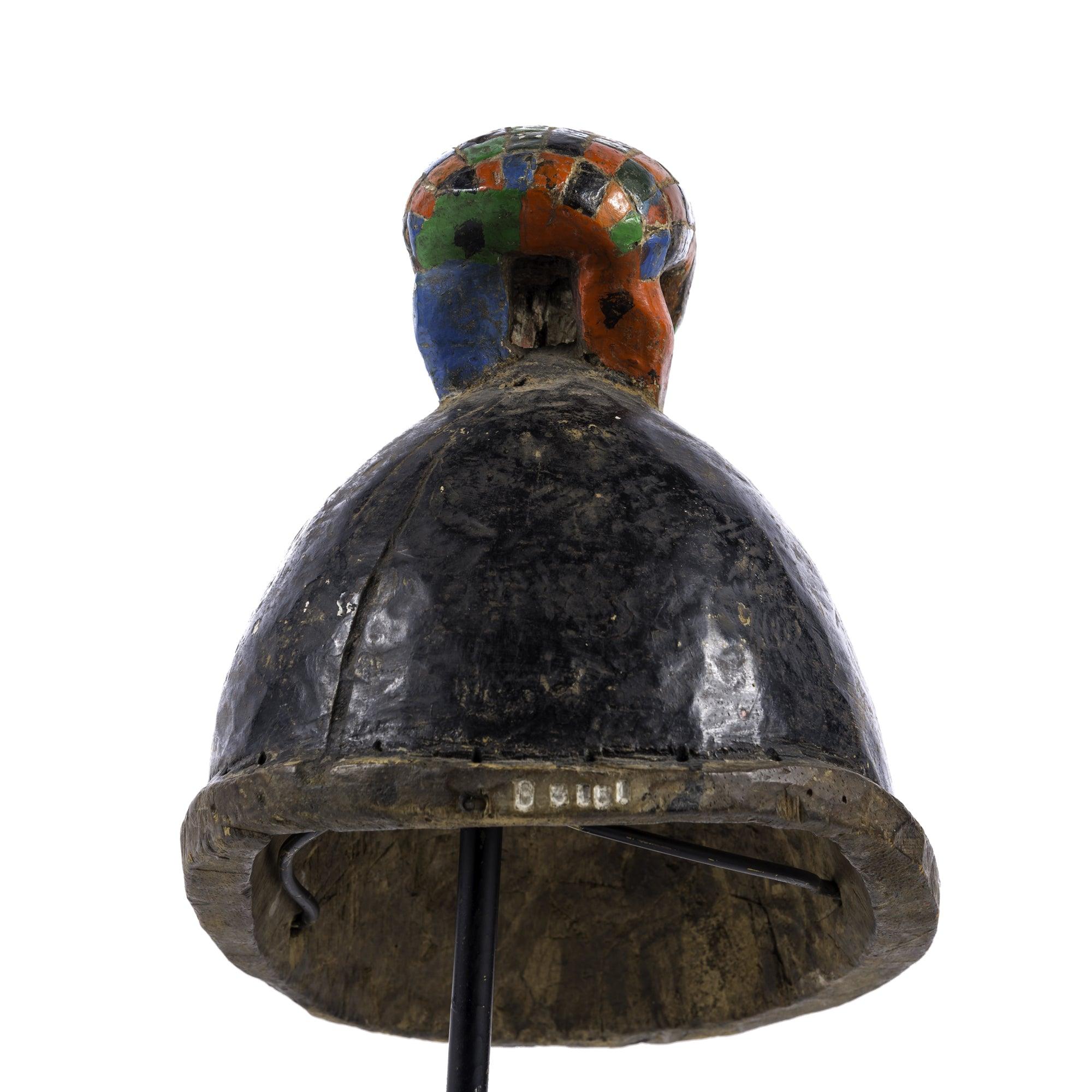 Yoruba Gelede Mask from Nigeria on a stand in back