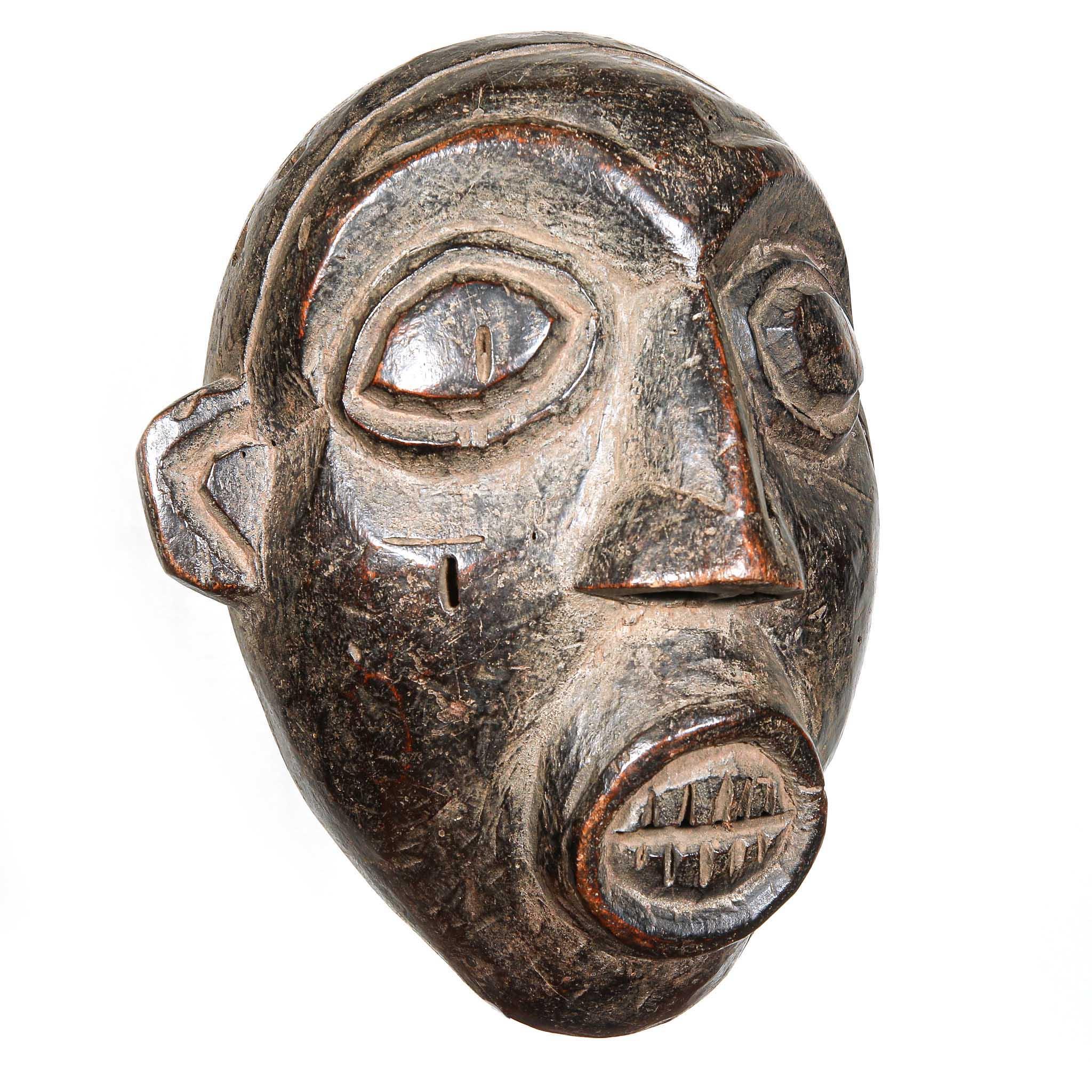 Night Society Bamaleki Mask from Cameroon left
