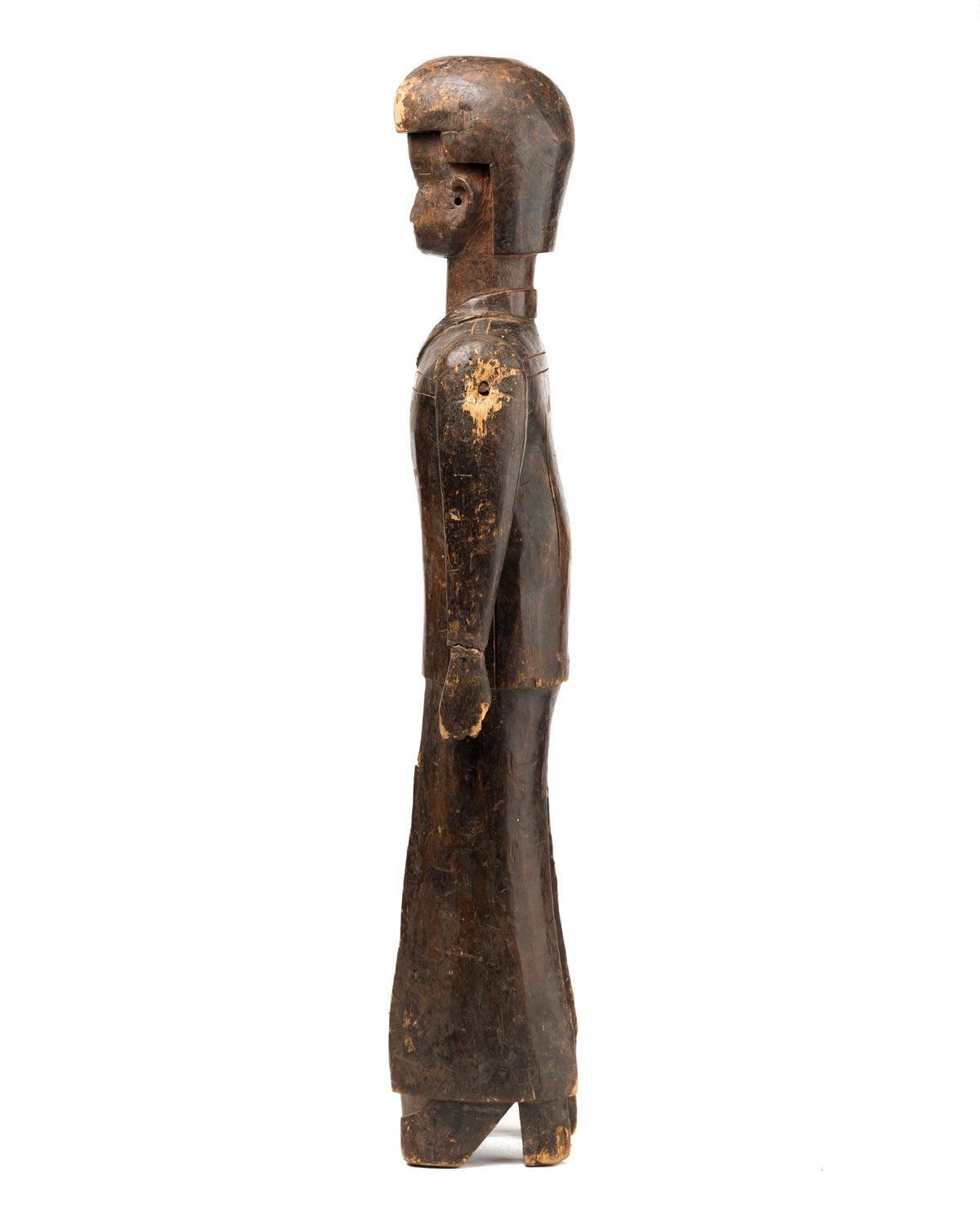 Antique wood African sculpture that looks like Elvis