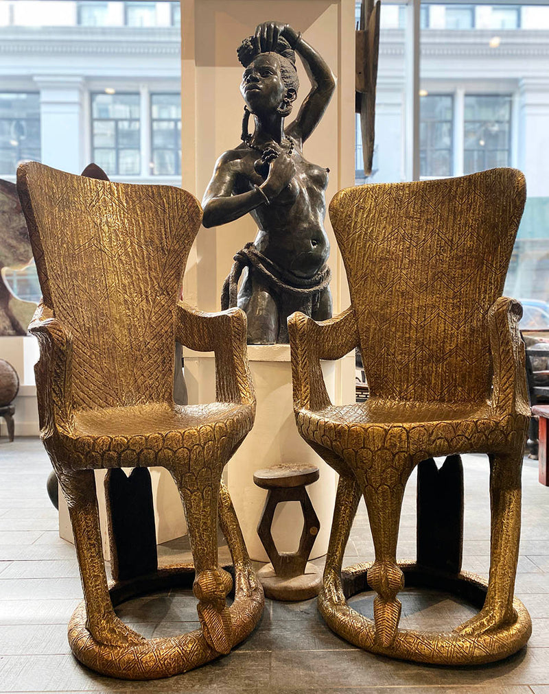 Pair of gold thrones with Shona sculpture