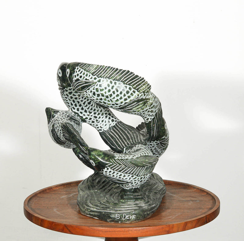 Swimming fish sculpture for outdoor design