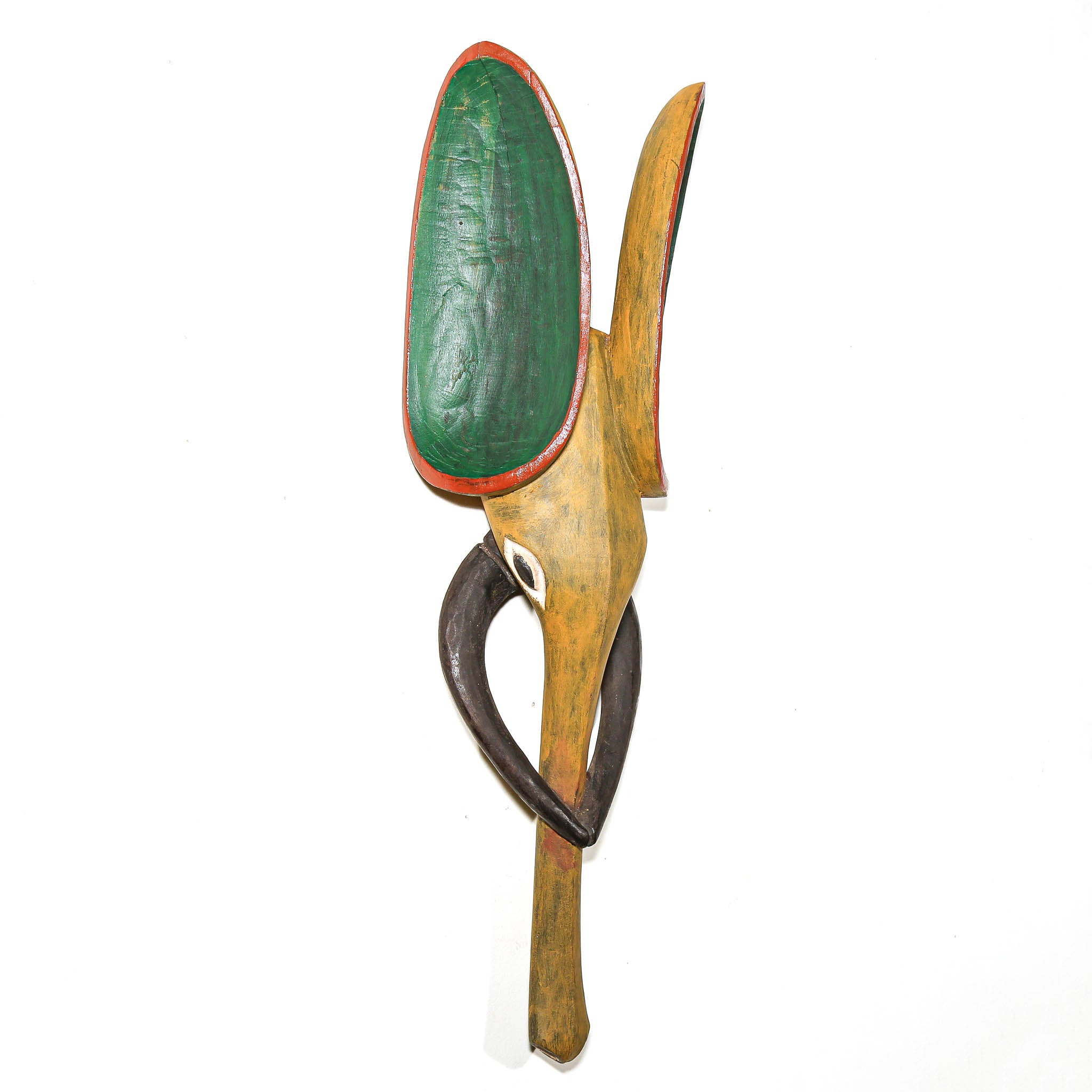 A handcrafted wooden wall art sculpture featuring a stylized bird or abstract animal form with a green painted wing, natural wood body, dark brown curved element, and red trim, shown against a plain white background.