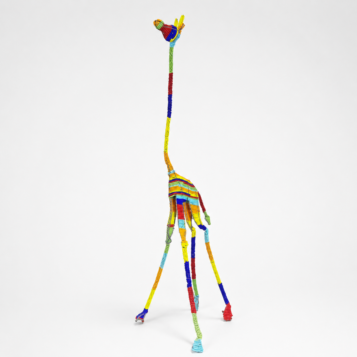 rainbow colored beaded giraffe sculpture from South Africa