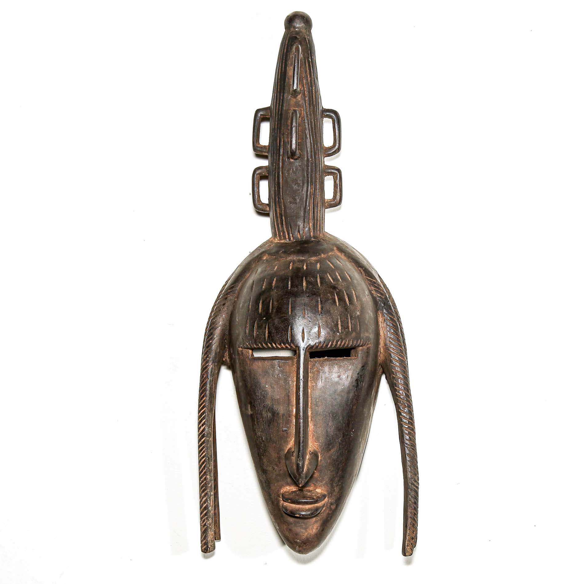 finely carved wooden modern african wall mask. Home and living room decor to hang on the wall