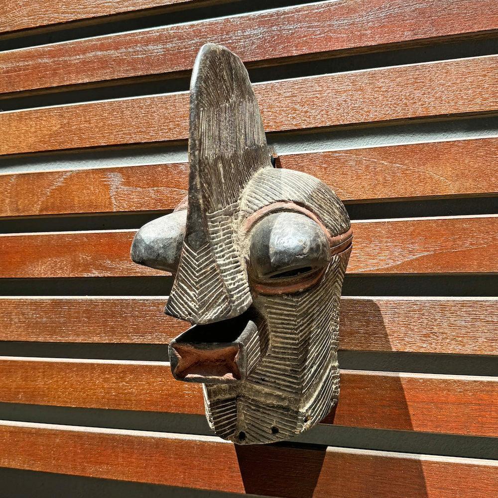 Songye Mask from D.R. Congo as an African mask wall decor idea at an angle