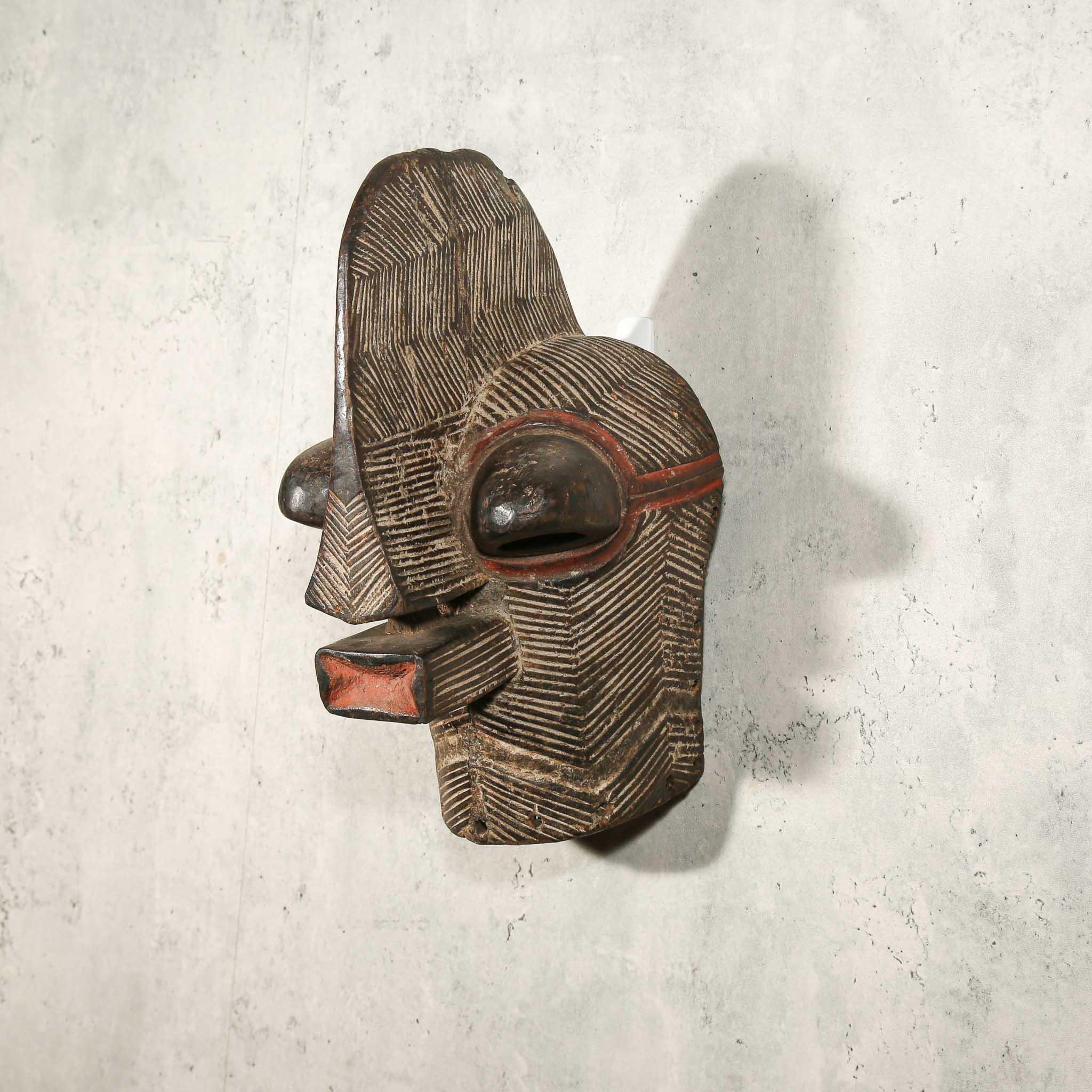 Songye Mask from D.R. Congo as an African mask wall decor idea showing left side 