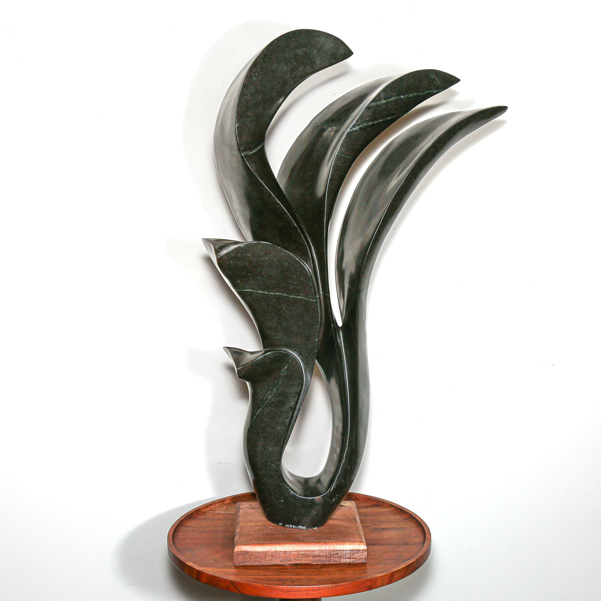 signed modern african sculpture in black stone