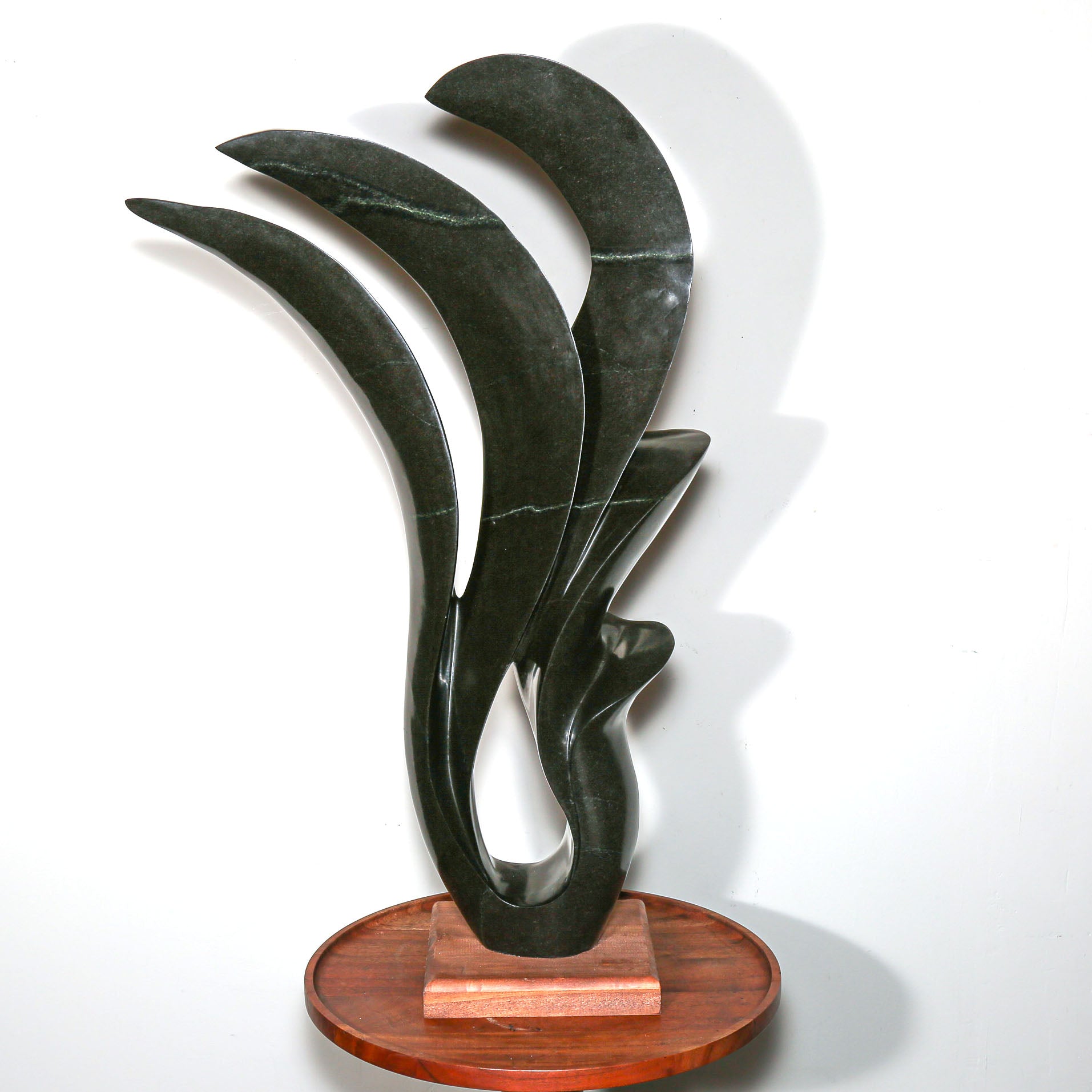 signed modern african sculpture in black stone