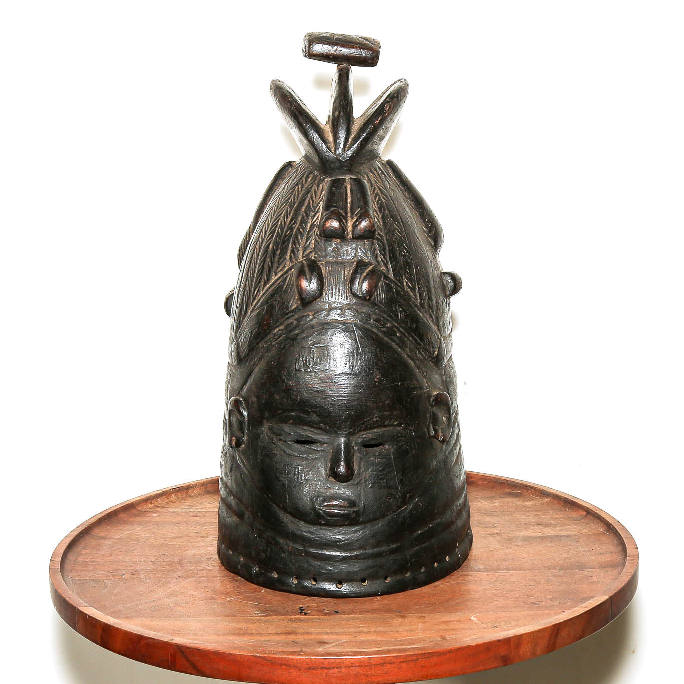 Carved black Mende helmet mask styled as African home decor