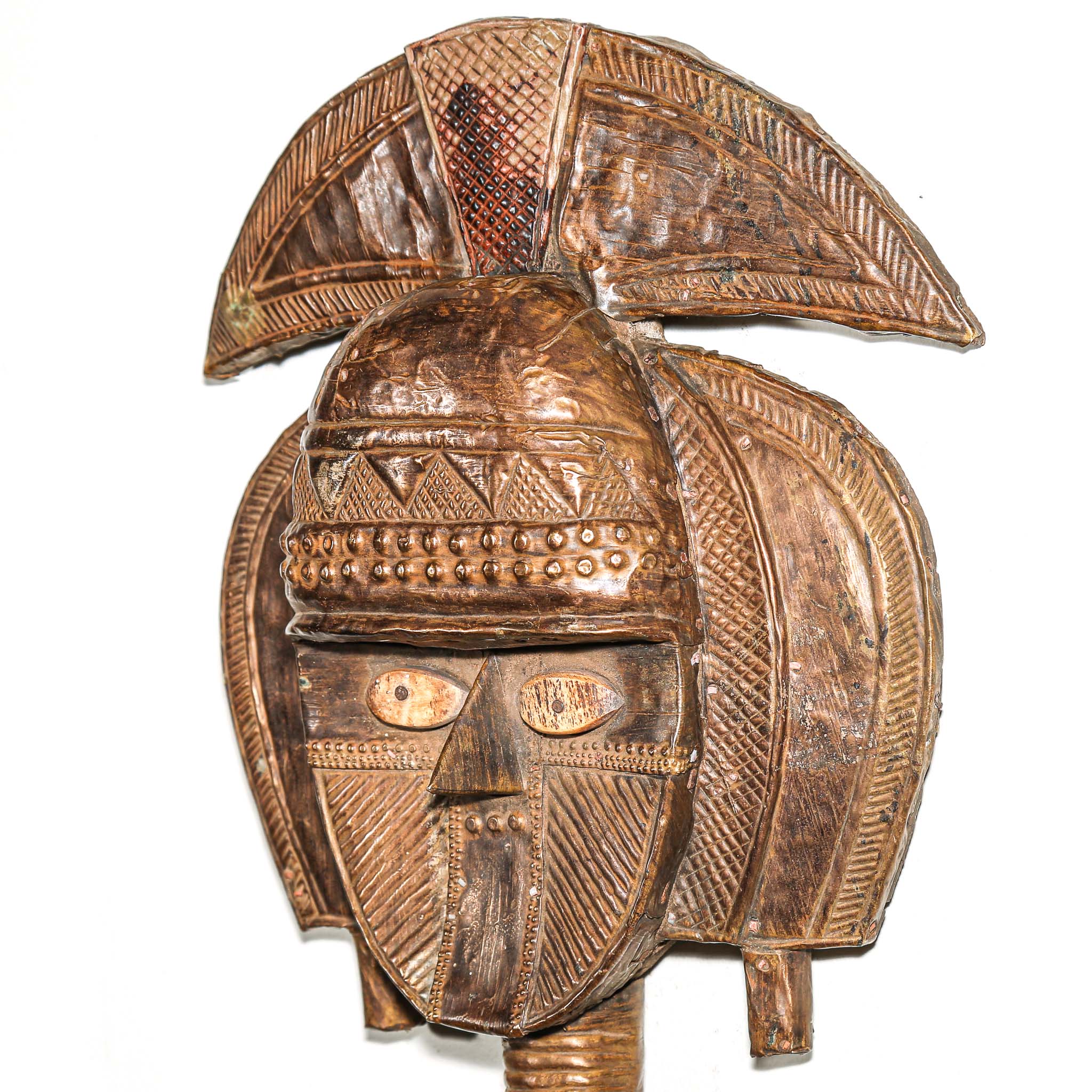 Close-up of copper and brass surface on antique Kota reliquary figure from Gabon