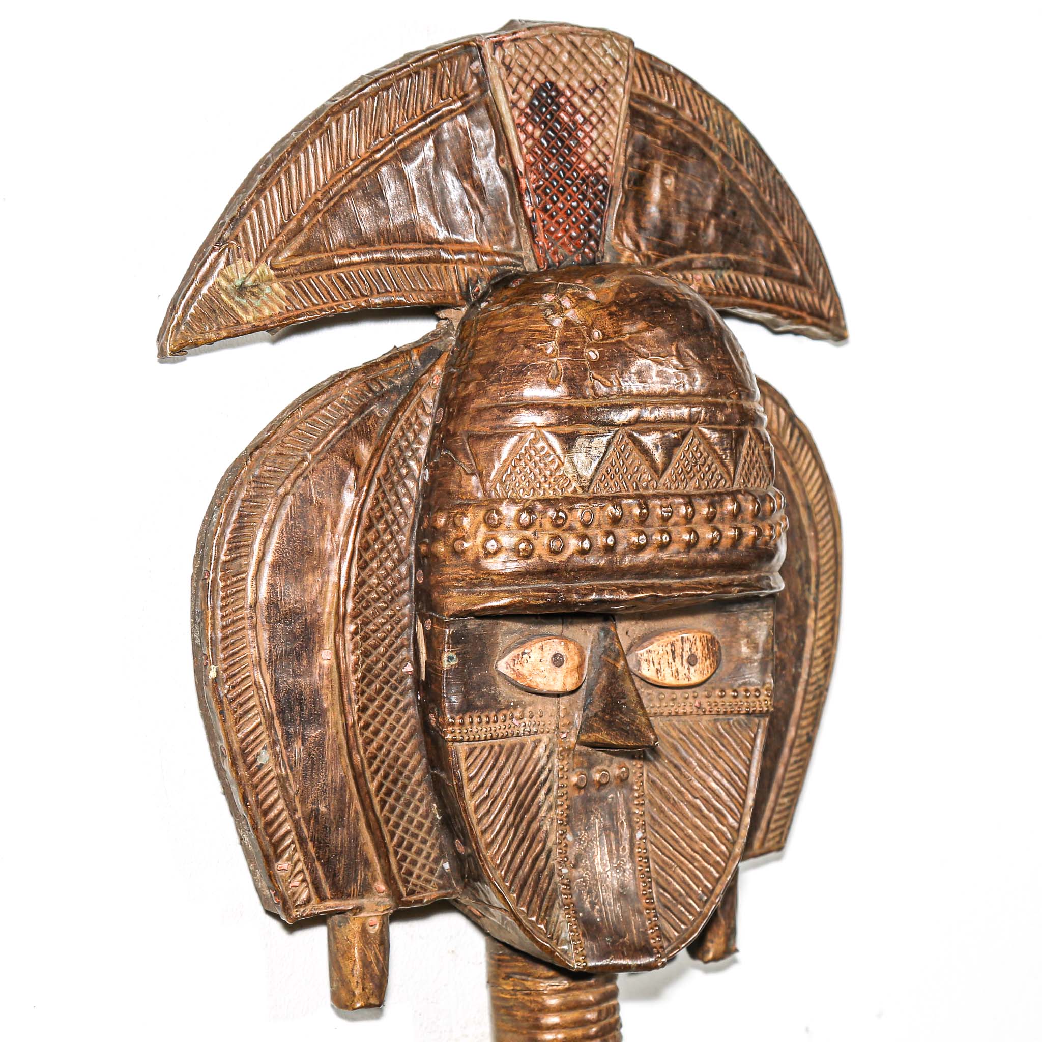 Close-up of copper and brass surface on antique Kota reliquary figure from Gabon