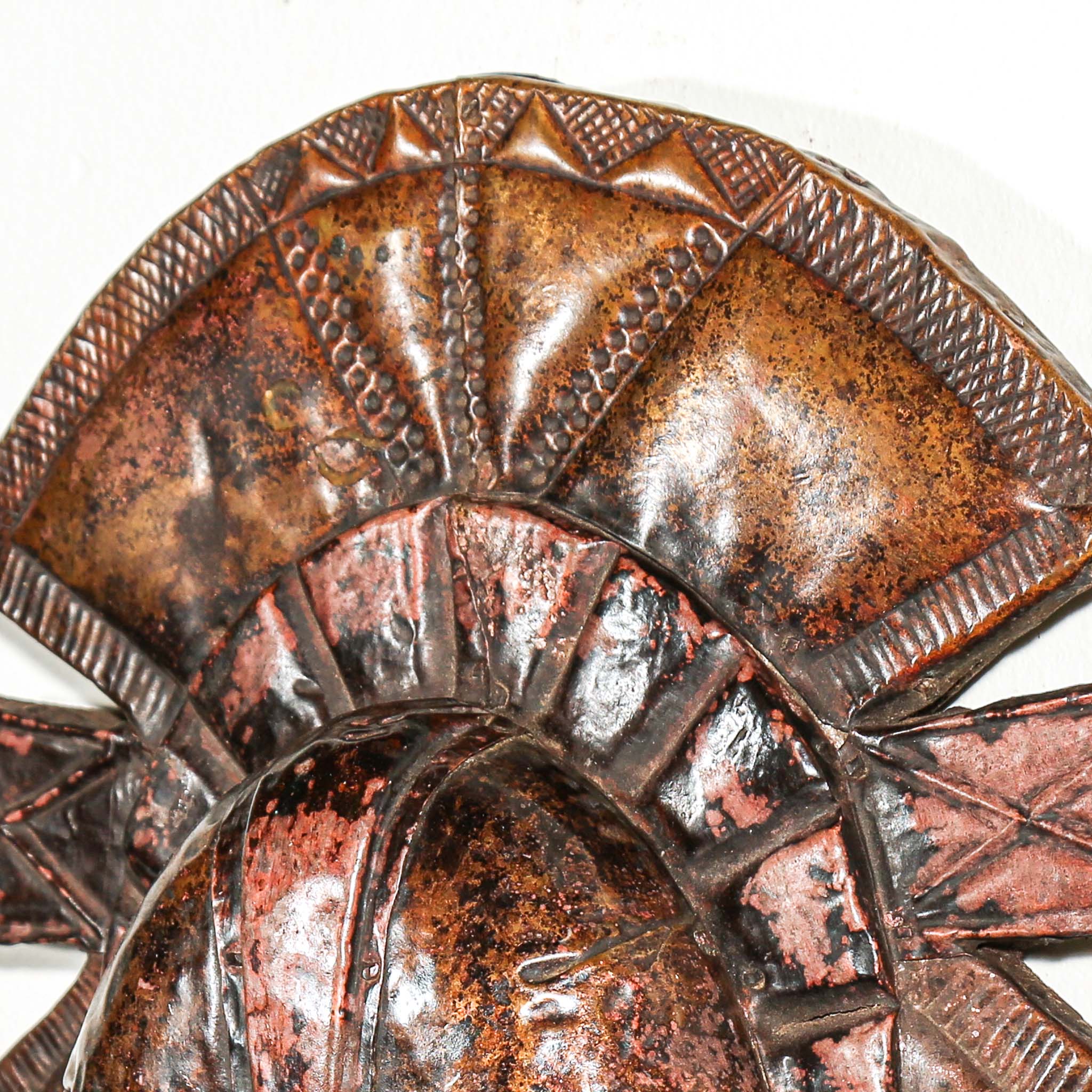 Side view of antique African Kota guardian sculpture from Gabon with metal overlay