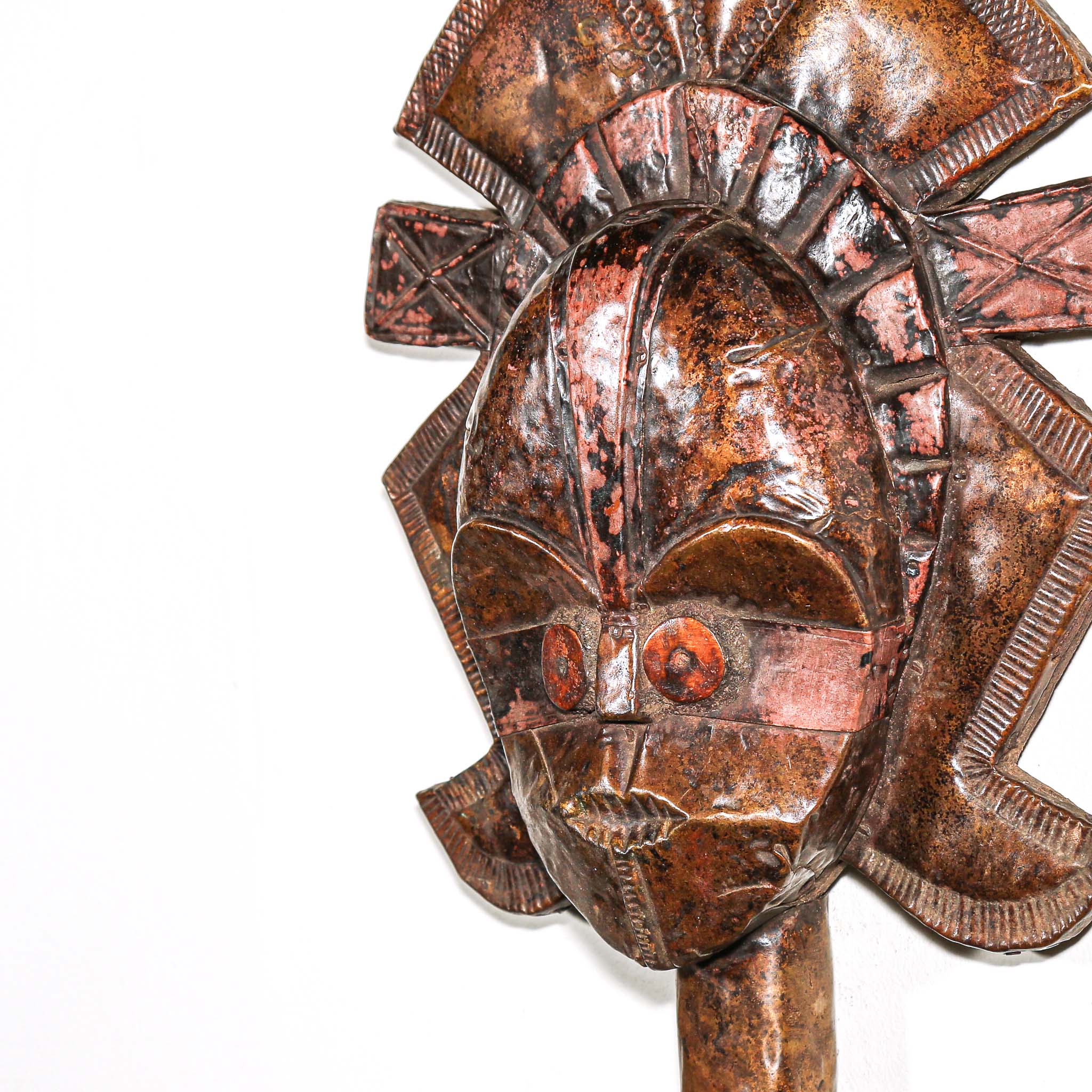 Side view of antique African Kota guardian sculpture from Gabon with metal overlay