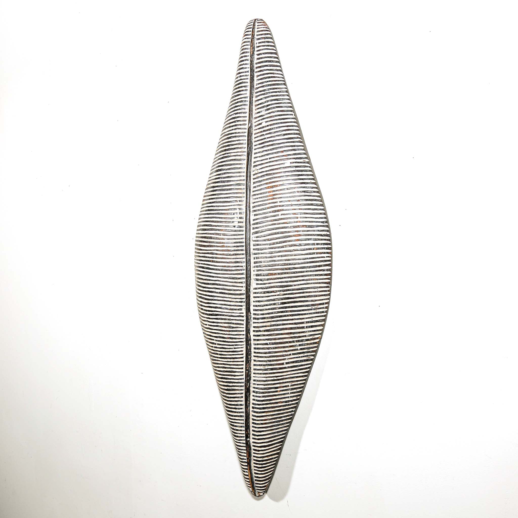 black and white wood African shield to hang on the wall for interior design ideas. Modern and tribal African art for sale.