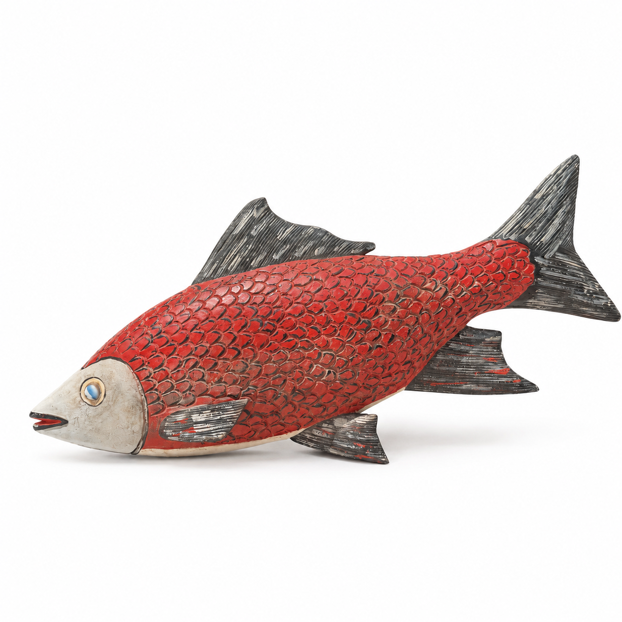 Red fish hand carved wood scutlpure on a white background