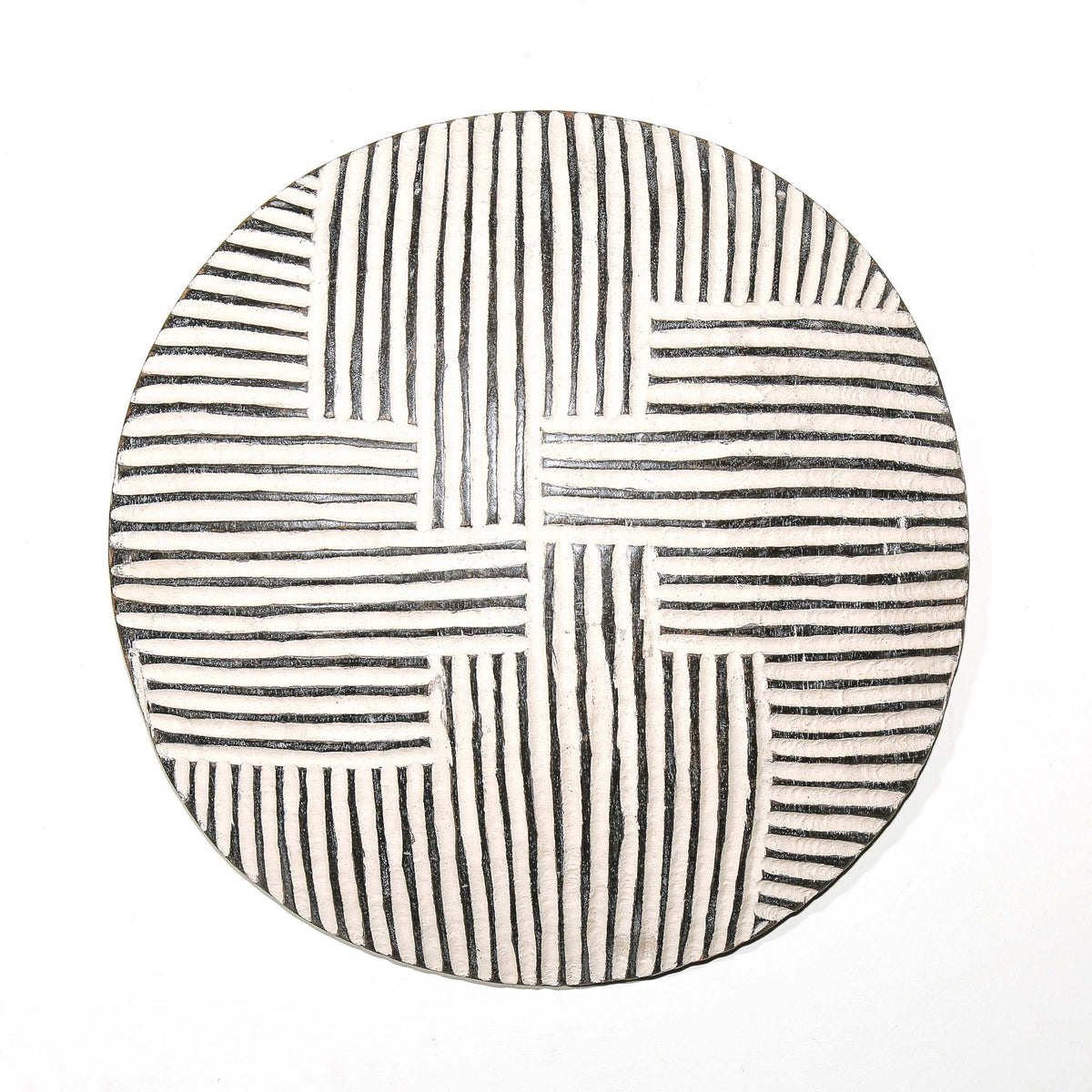Medium round decorative shield from Cameroon with bold graphic detailing and a balanced sculptural wall-hanging form