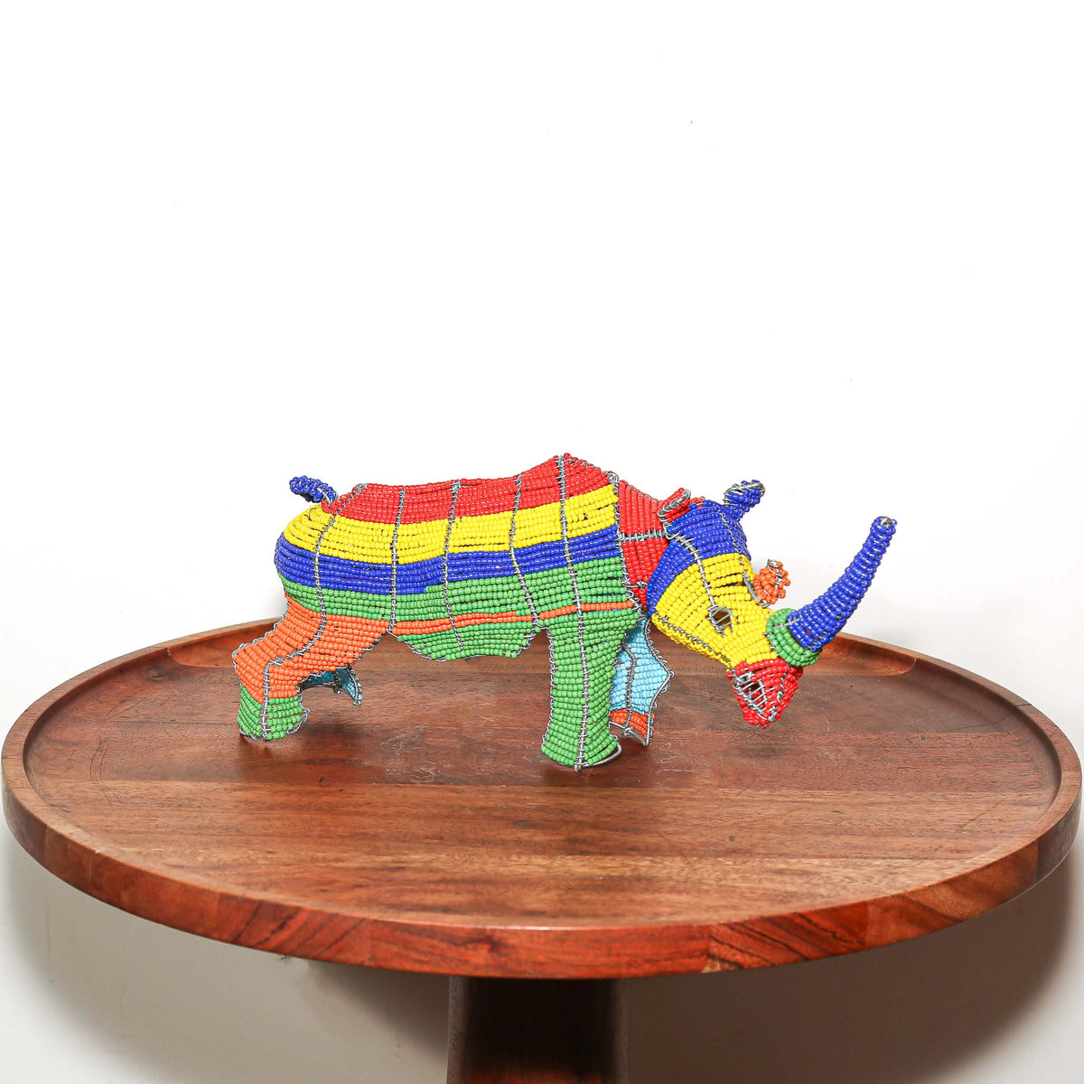 Handmade beaded wire rhino sculpture by South African artists with colorful beadwork and detailed animal form