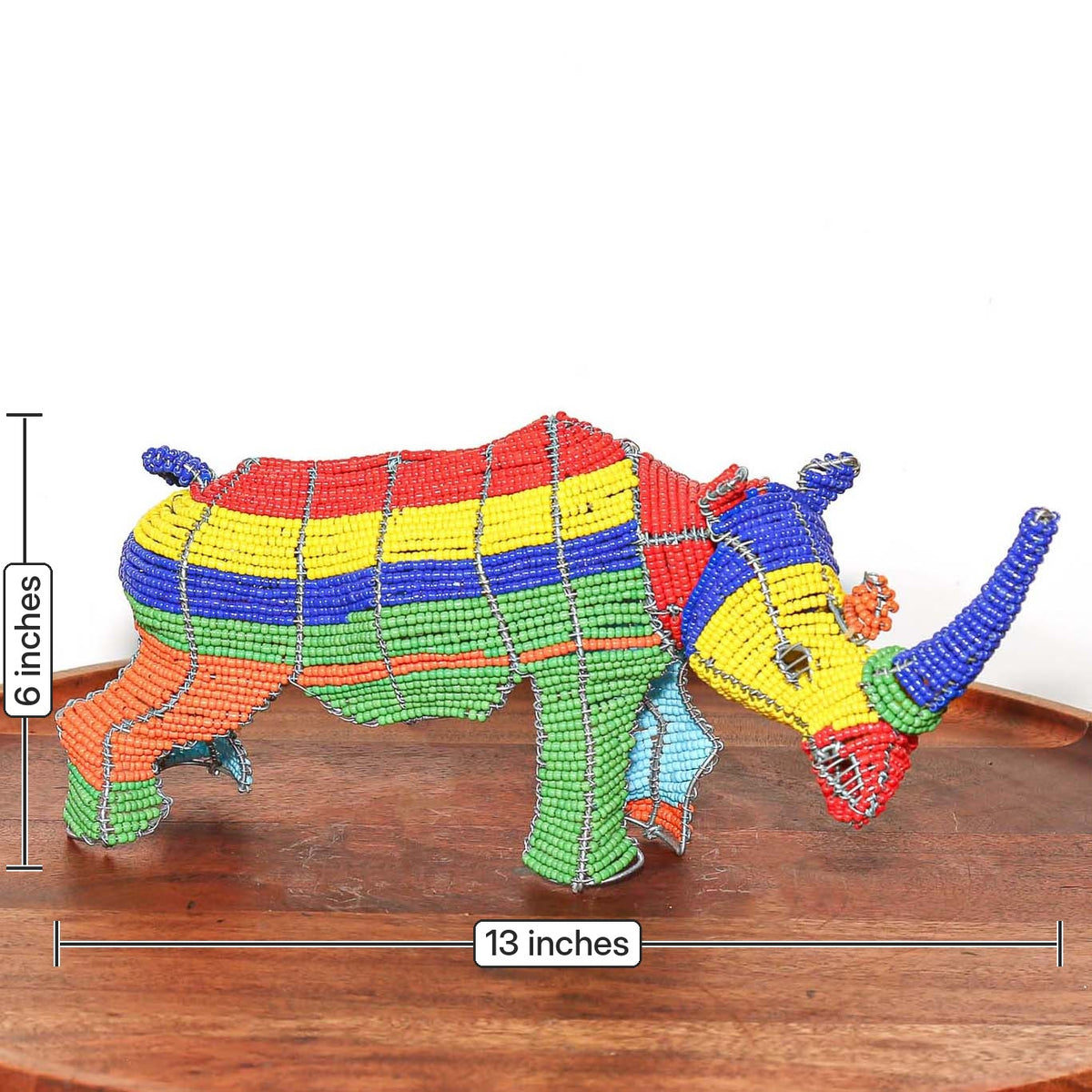 South African beaded wire rhino sculpture displayed as small handmade African animal art for shelf or tabletop decor