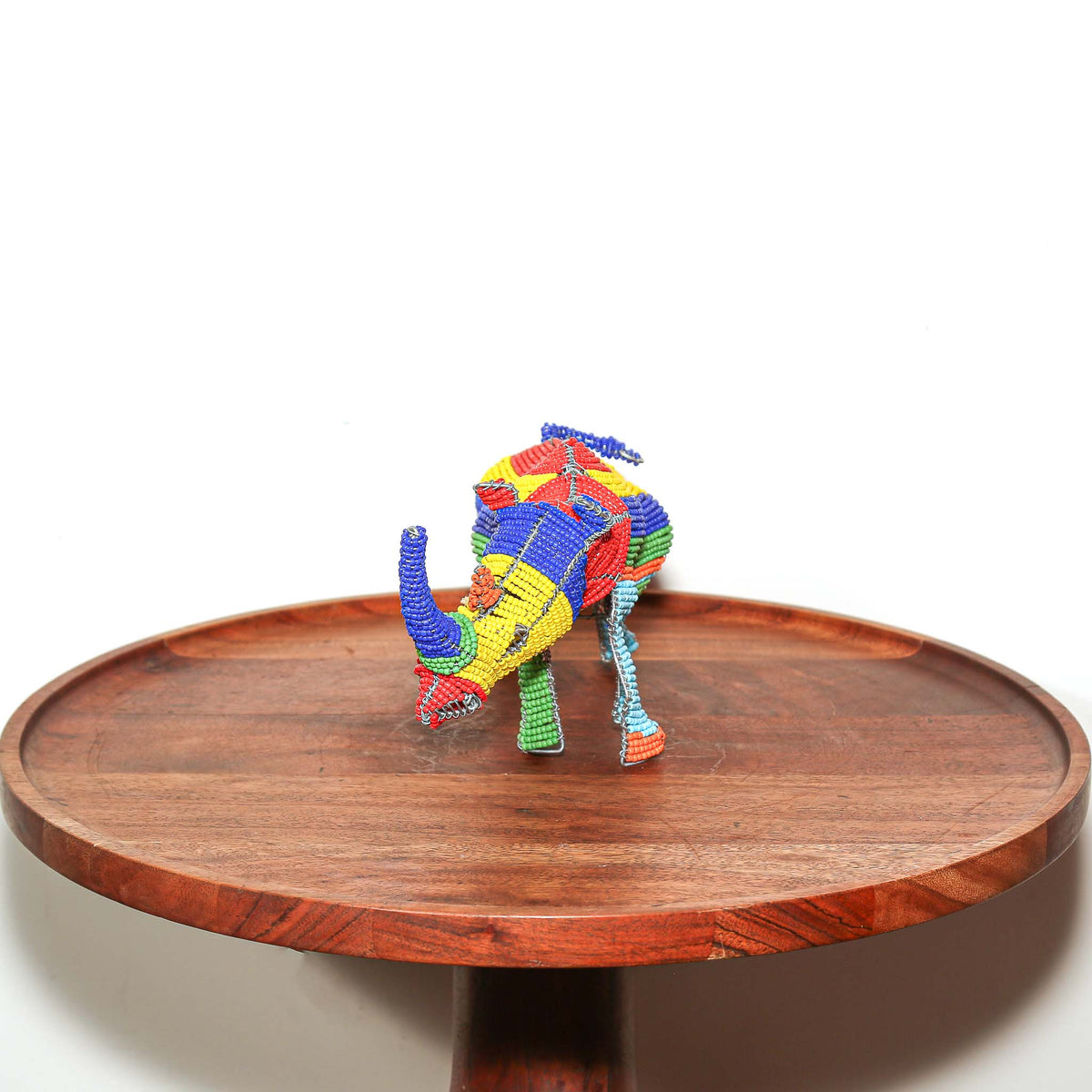 Small African rhino sculpture handcrafted from wire and beads in South Africa as decorative collectible art