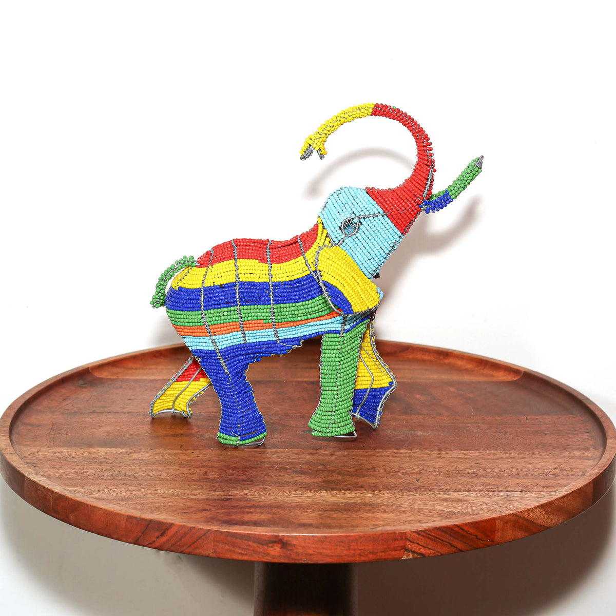 South African wire and bead elephant sculpture displayed as a small handmade piece of African animal art for home decor