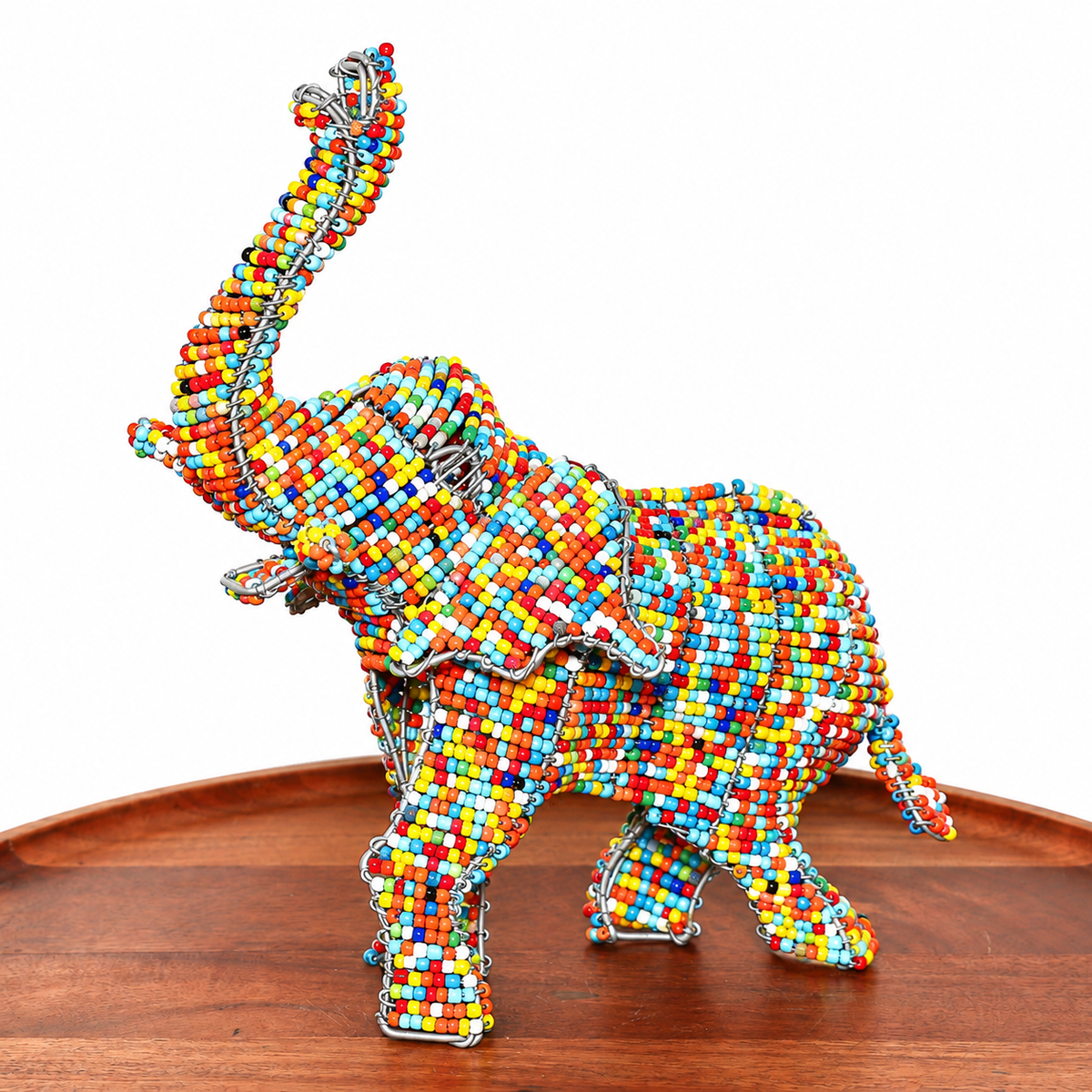 Colorful wire and bead elephant sculpture handmade in South Africa with playful detailing and a compact decorative form