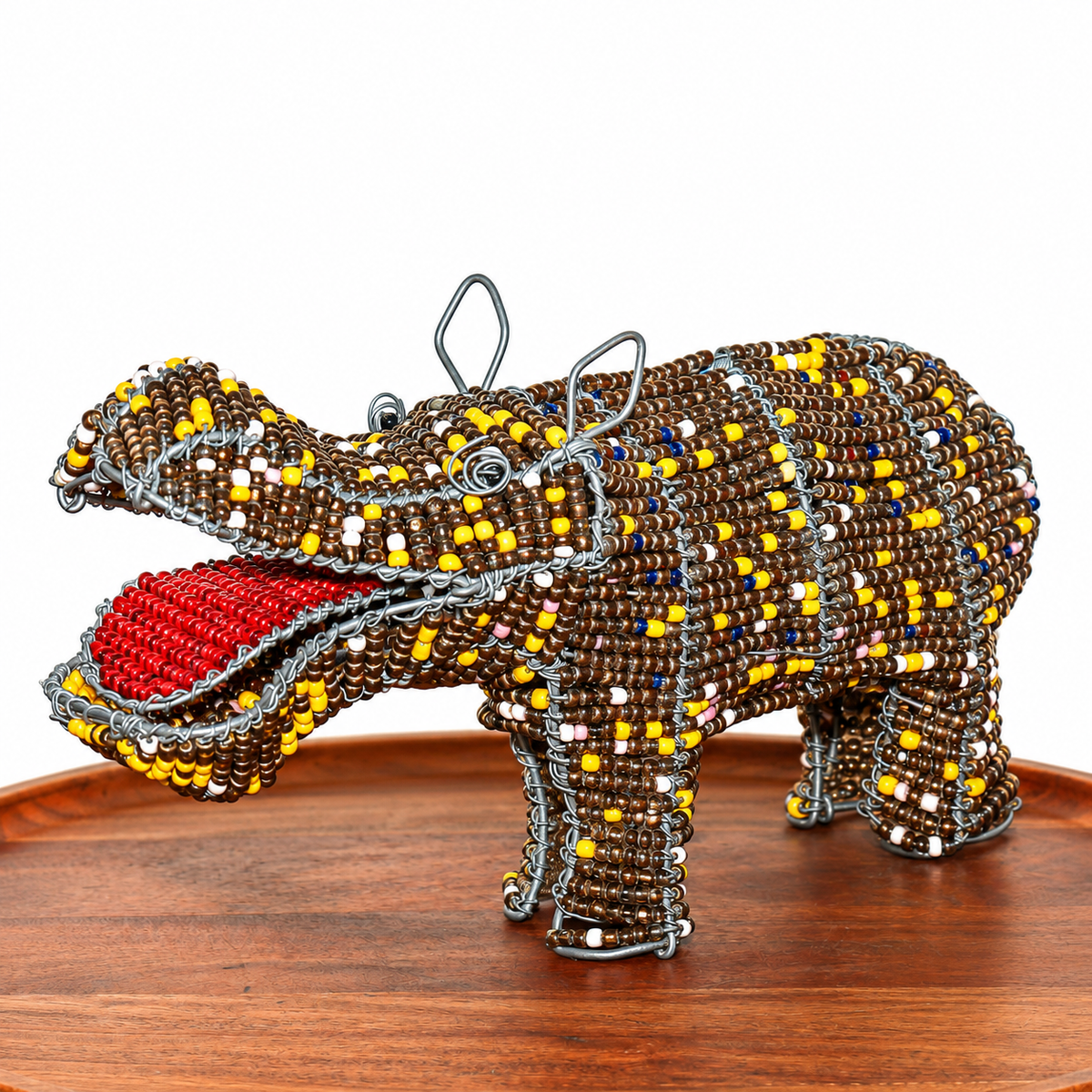 Handmade beaded wire hippo sculpture from South Africa with colorful beadwork and a rounded animal form