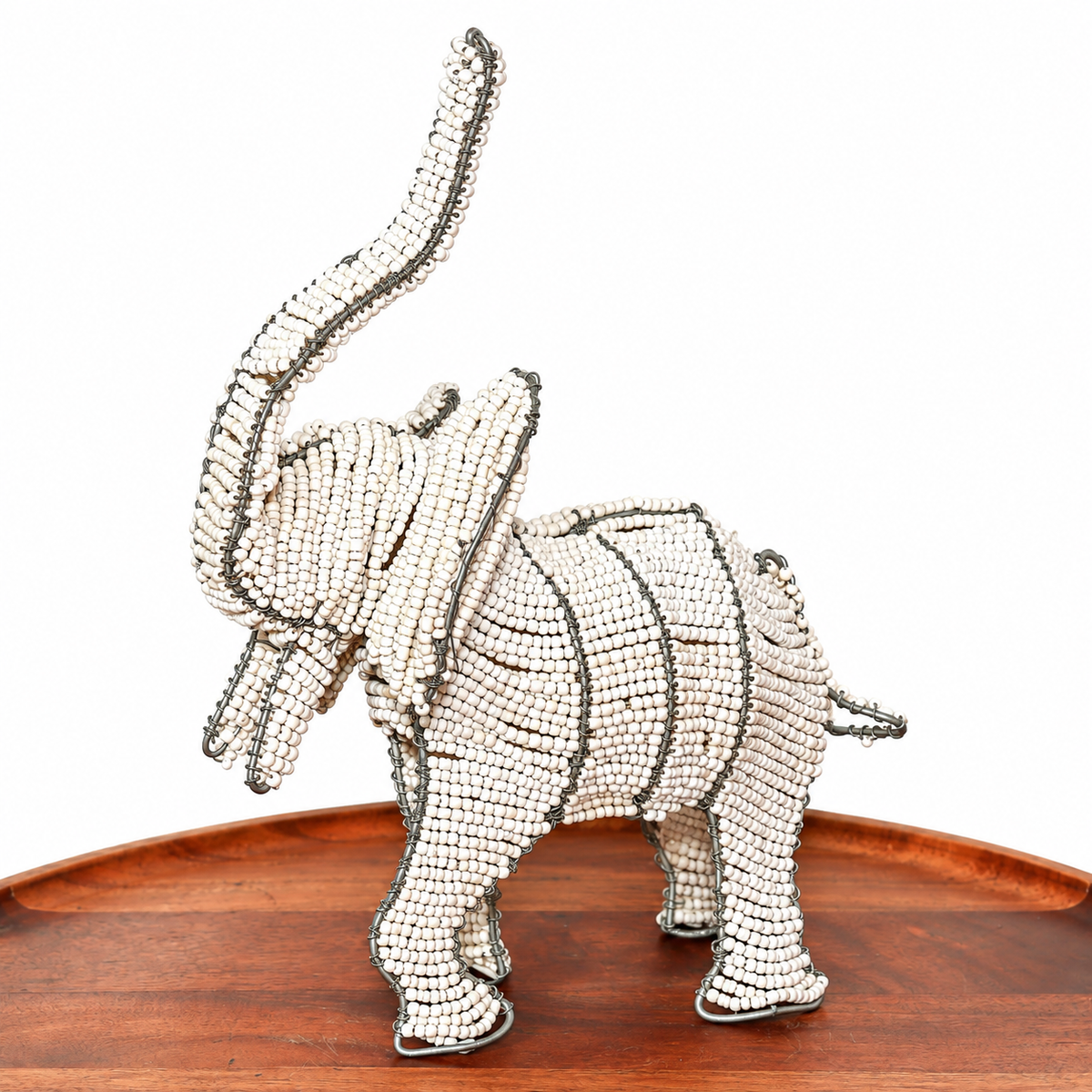 White beaded elephant sculpture handmade by South African artists with detailed wirework and a clean decorative finish