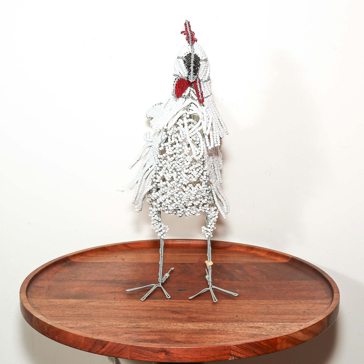 Decorative African rooster made from beads and wire, designed as a playful small sculpture for shelf or tabletop display
