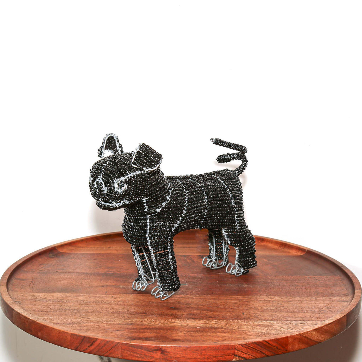 Handcrafted South African pug figurine made from black beads and wire with playful character and detailed artisan work