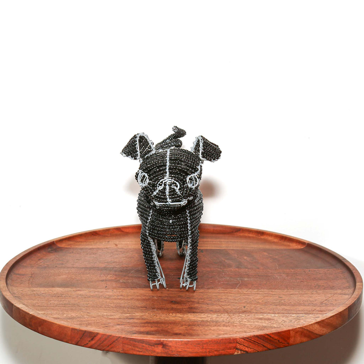 Decorative pug dog made with black beads and wire in South Africa, designed as a small sculptural accent for shelf or tabletop display