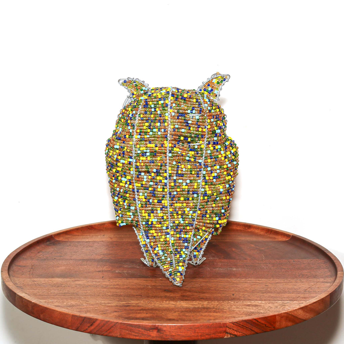 Handmade South African wire and bead owl with golden coloring, expressive form, and distinctive collectible art character