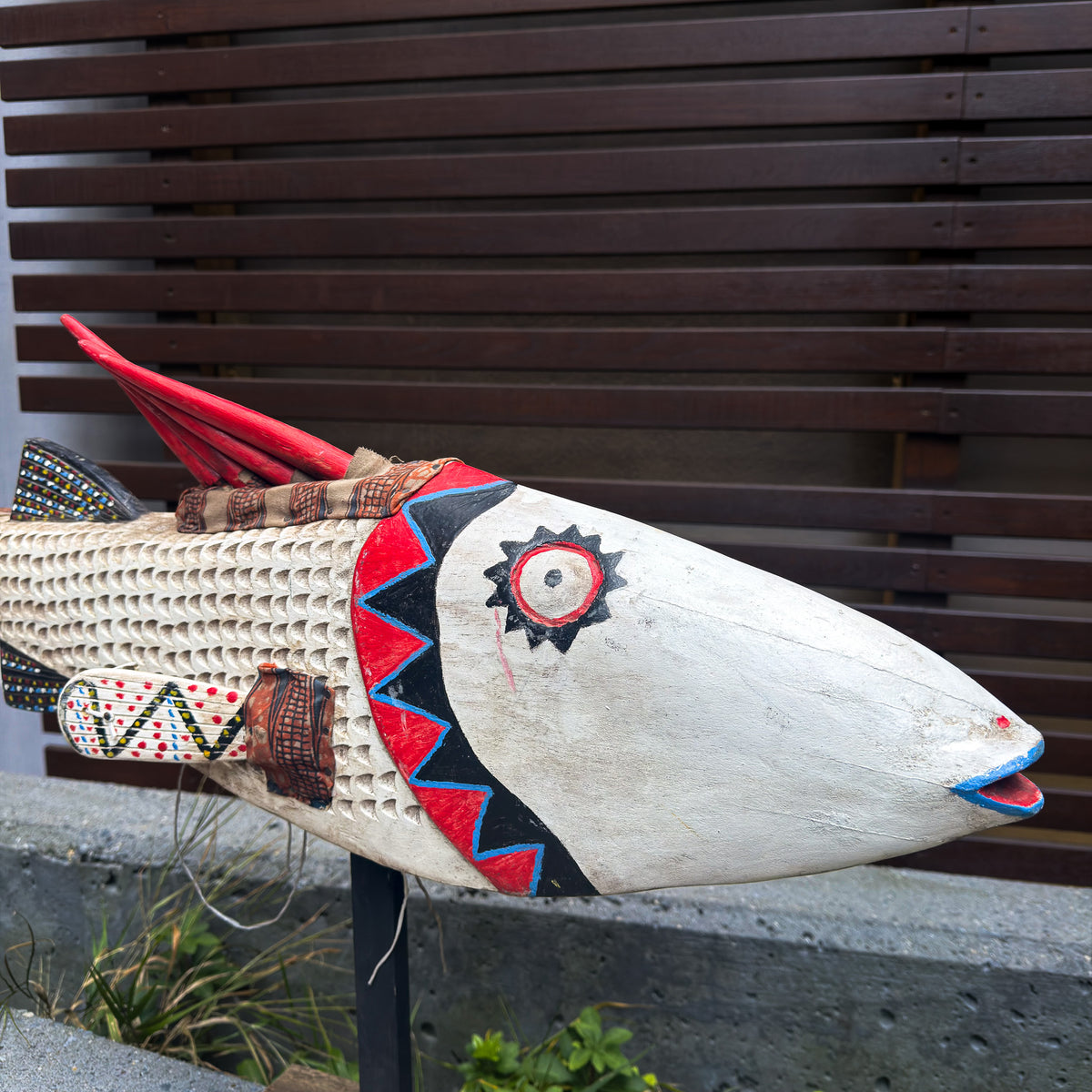 Handcrafted large white fish puppet sculpture with textured surface details and a dramatic decorative form