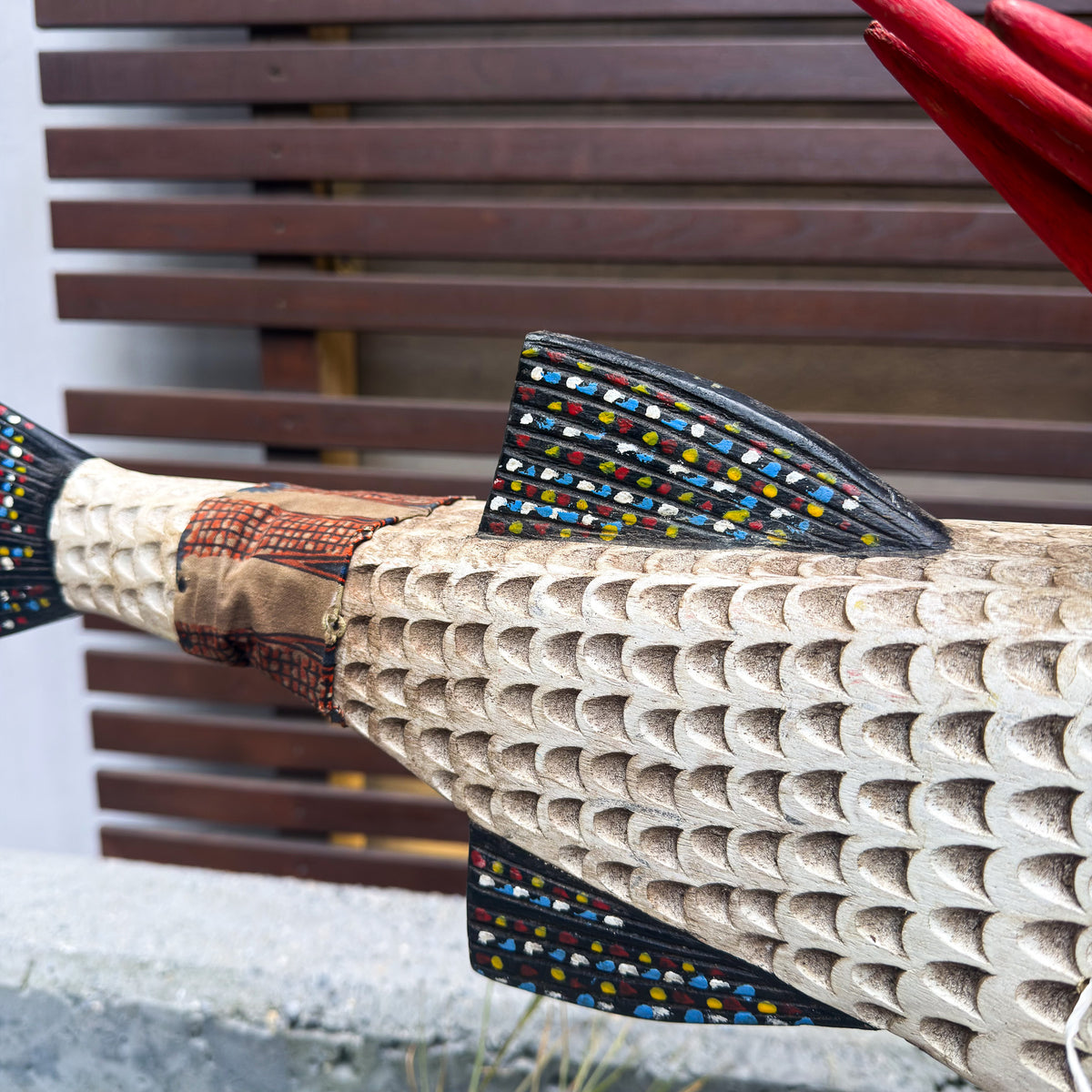 Large white African fish sculpture puppet with articulated construction and striking sculptural character