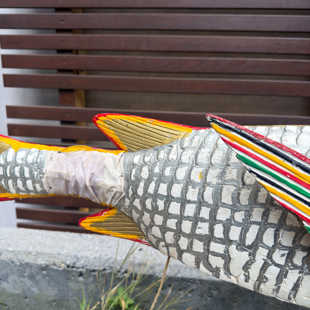Handcrafted large white fish puppet sculpture with textured surface details and a dramatic decorative form