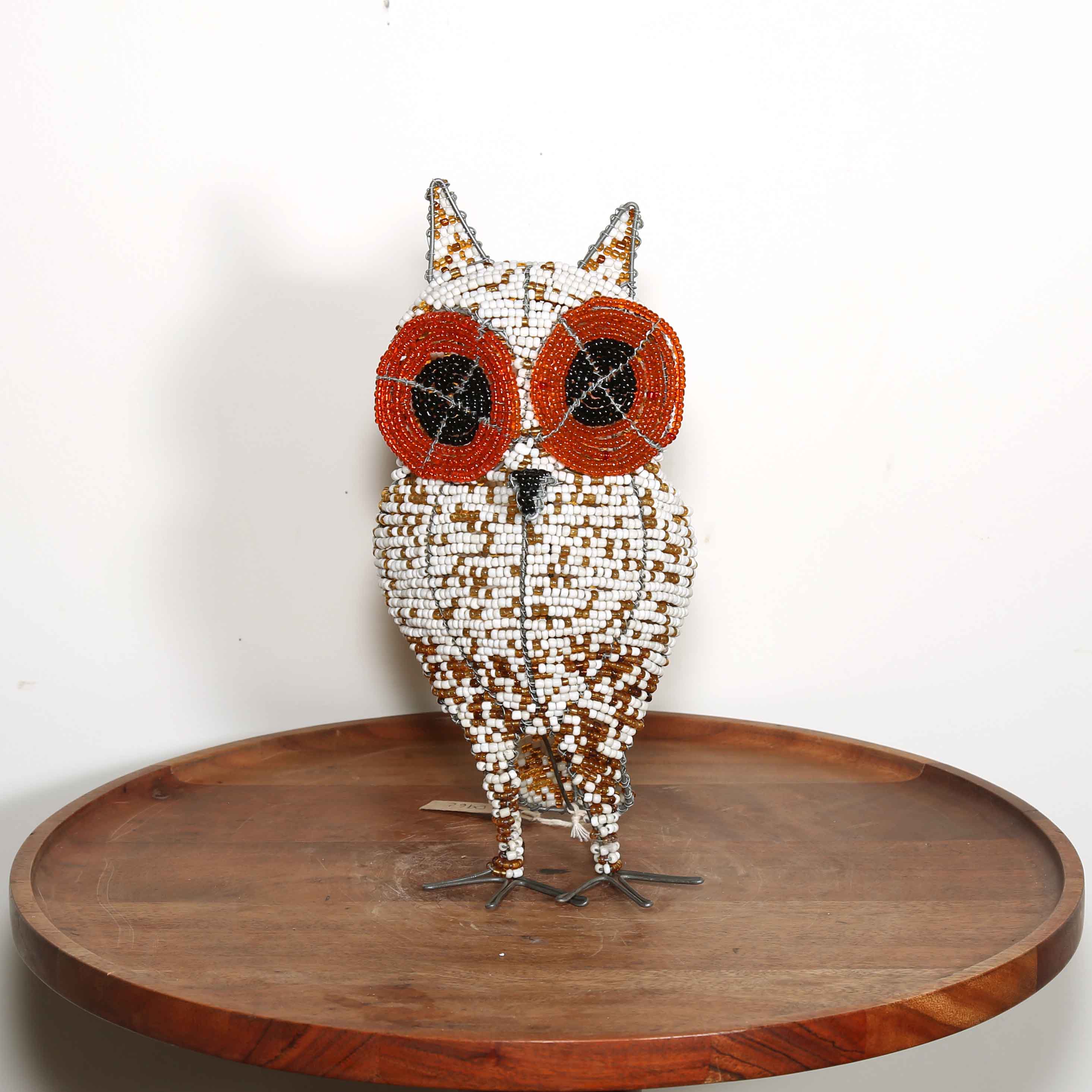 red and white African owl artwork