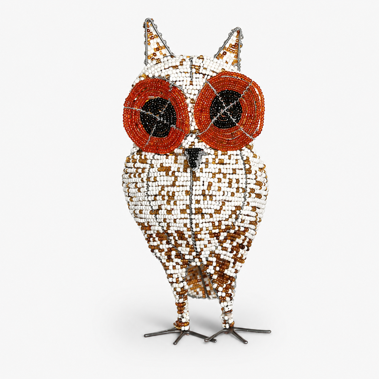 Decorative owl sculpture with beaded design on a white background