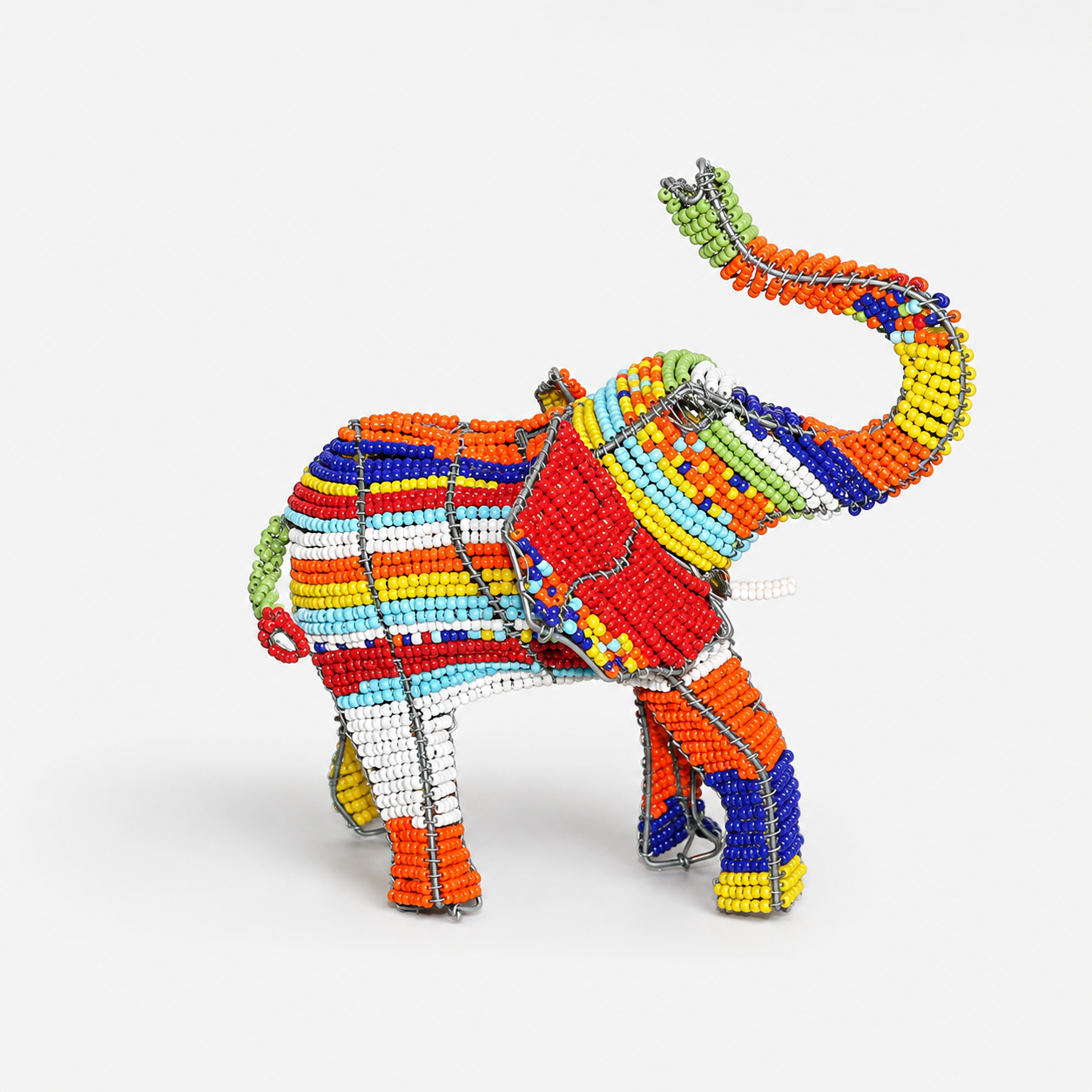 Colorful beaded elephant toy on a white background