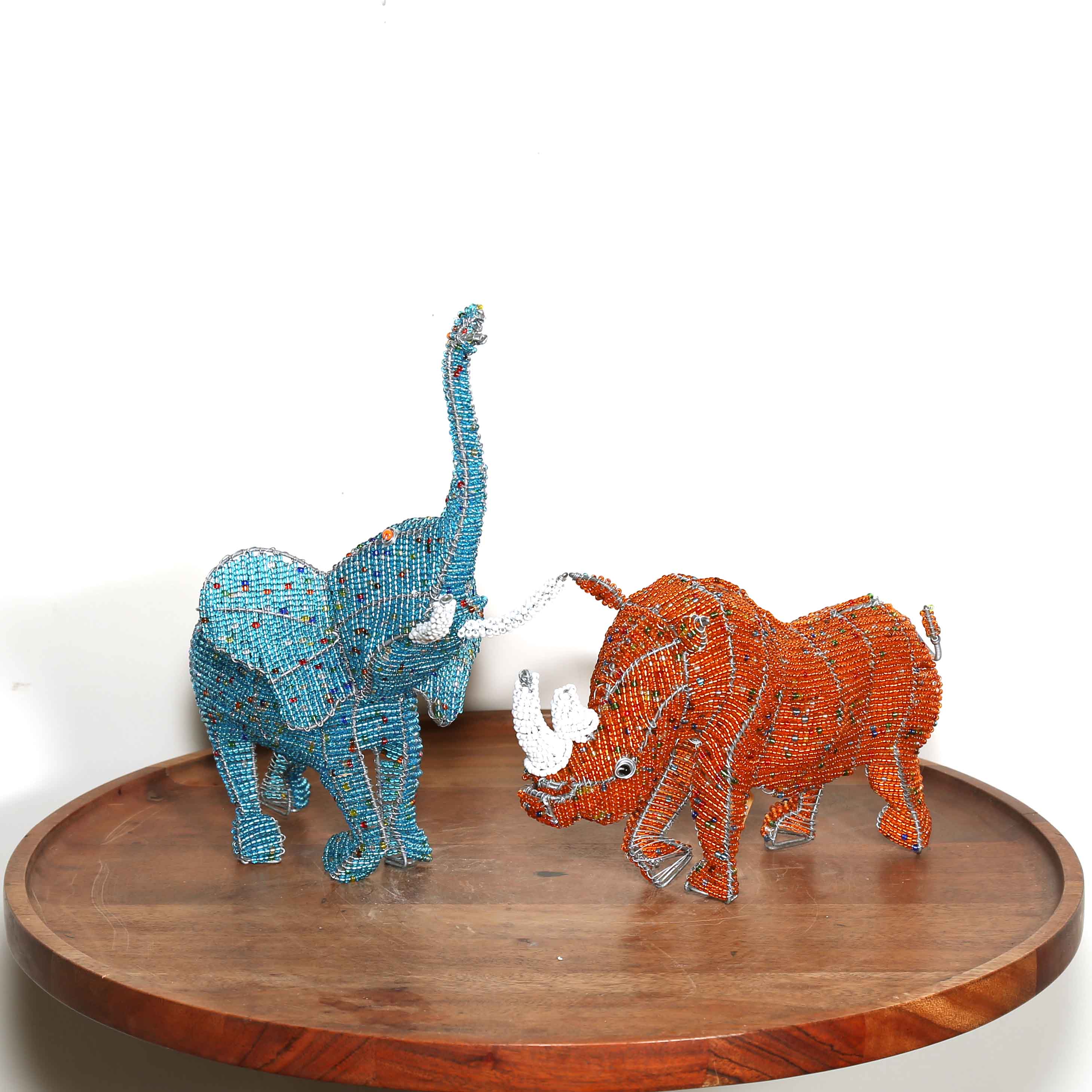 Small orange hand beaded rhino sculpture from Africa