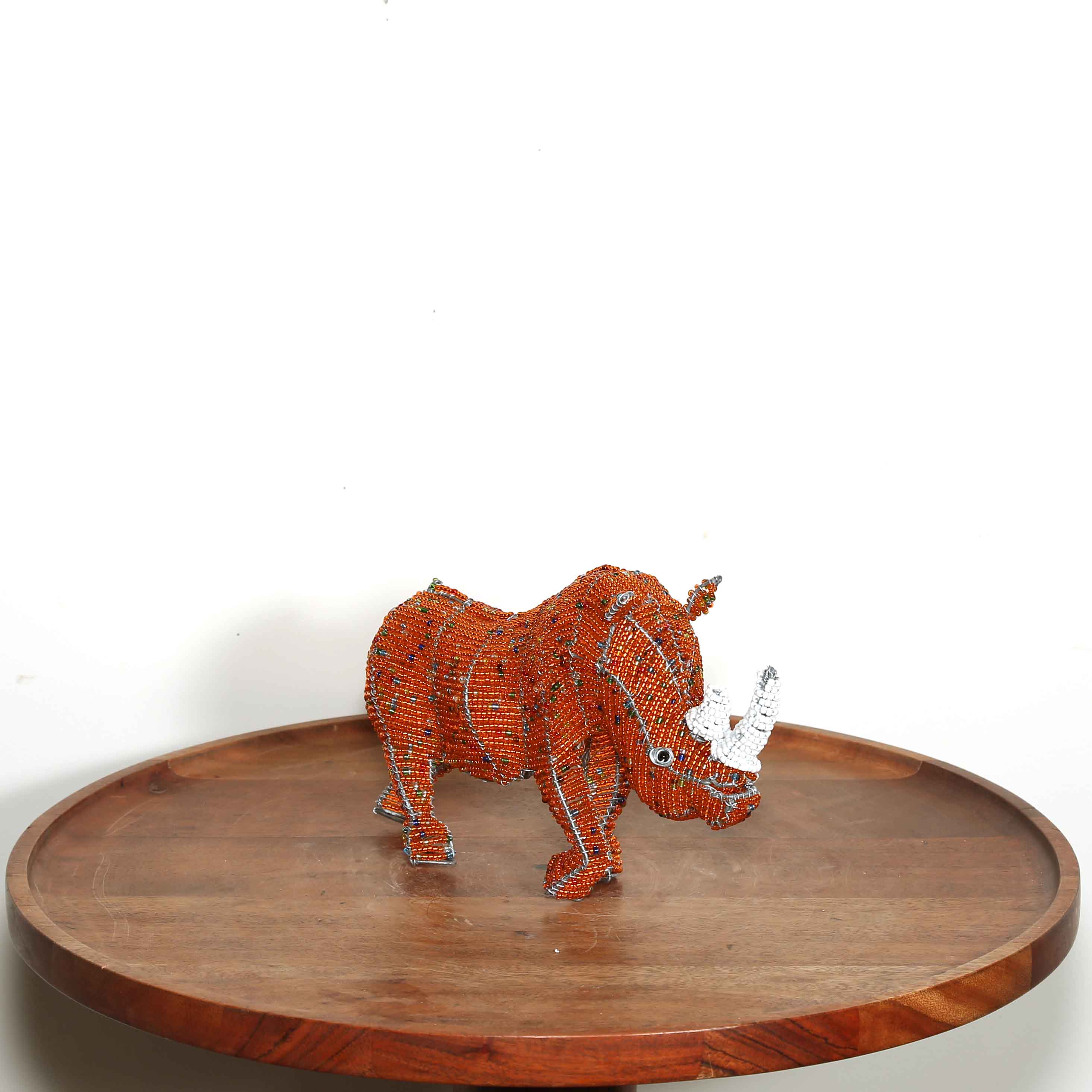 Small orange hand beaded rhino sculpture from Africa