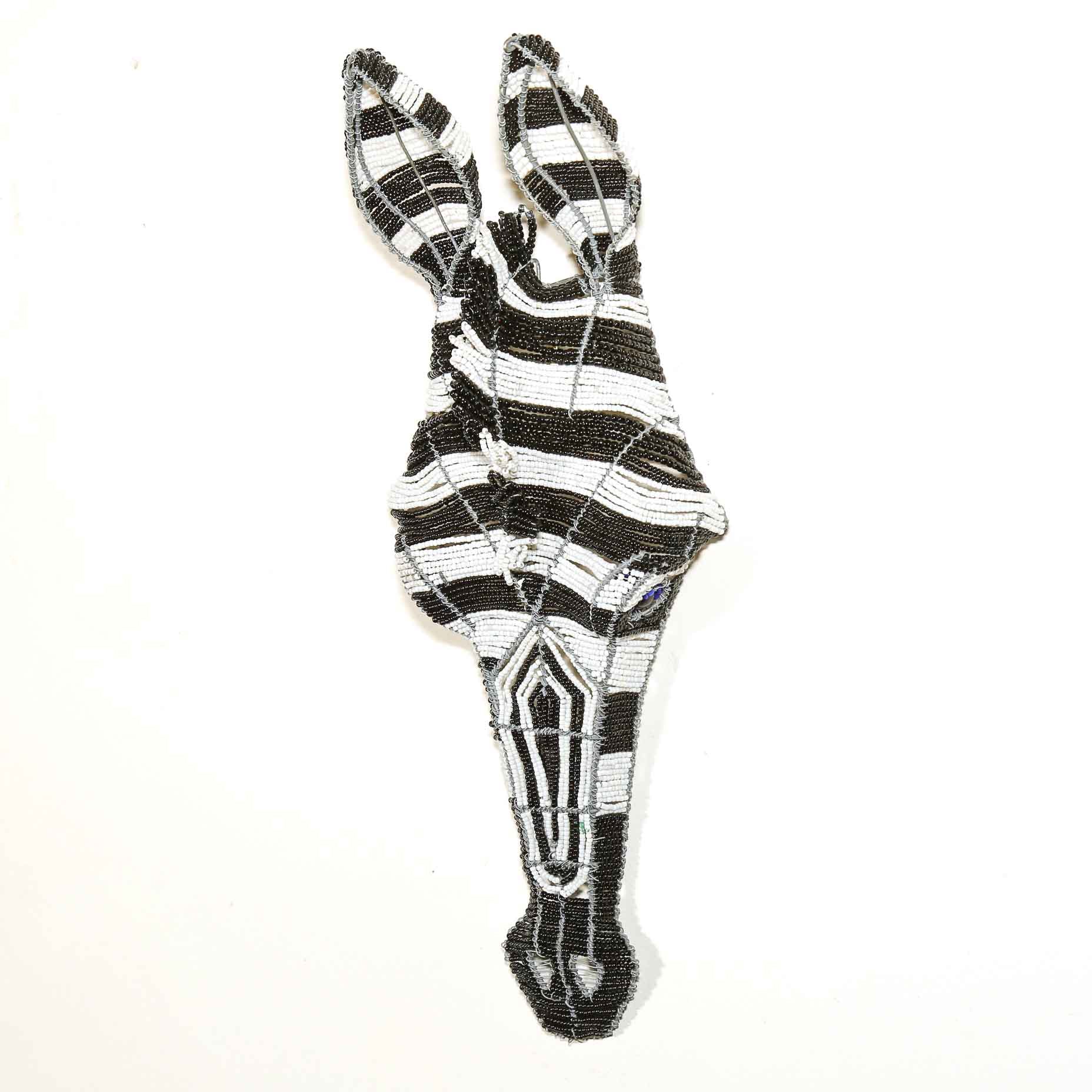 black and white beaded sculpture of a Zebra head to hang on the wall