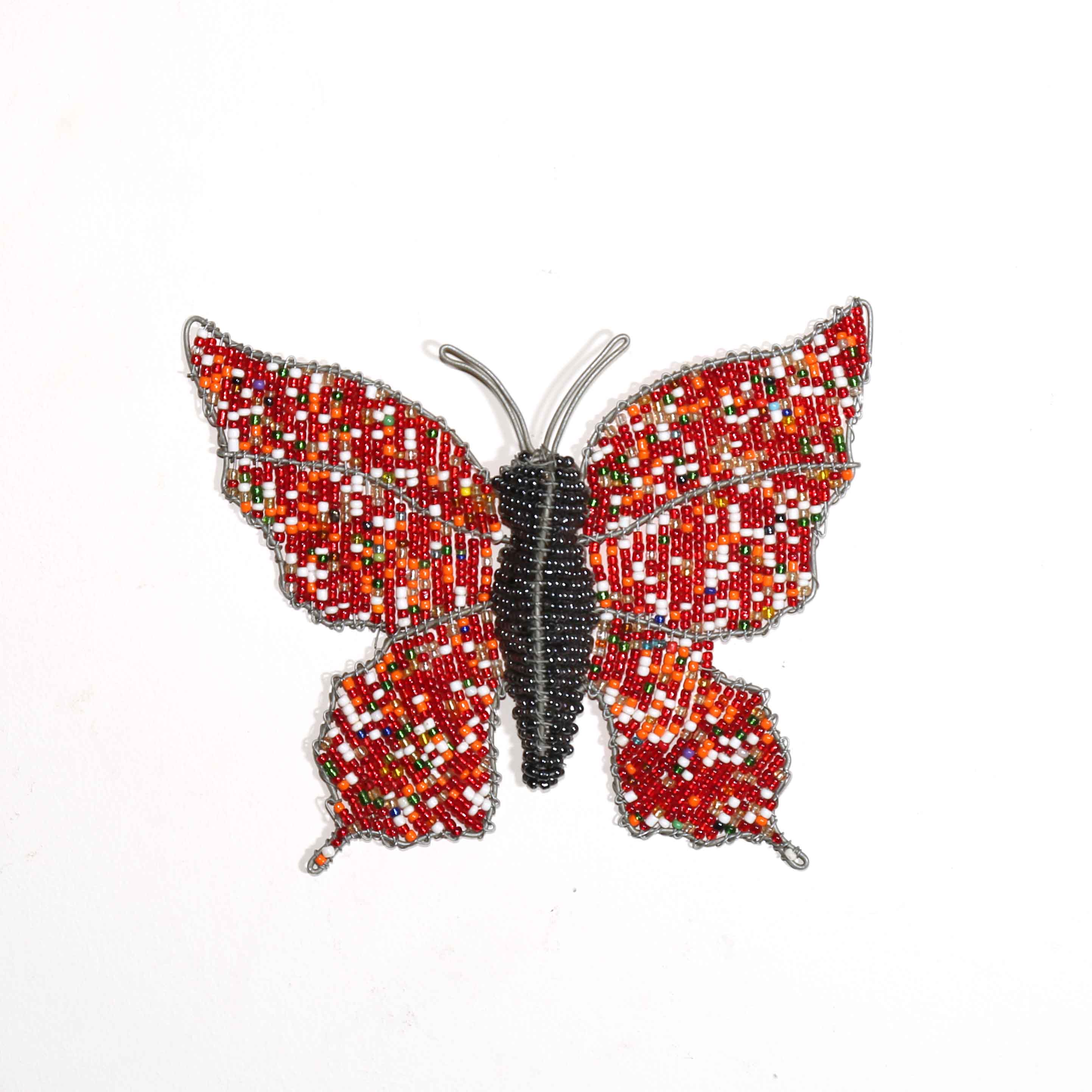 Decorative butterfly with red and silver pattern on a white background