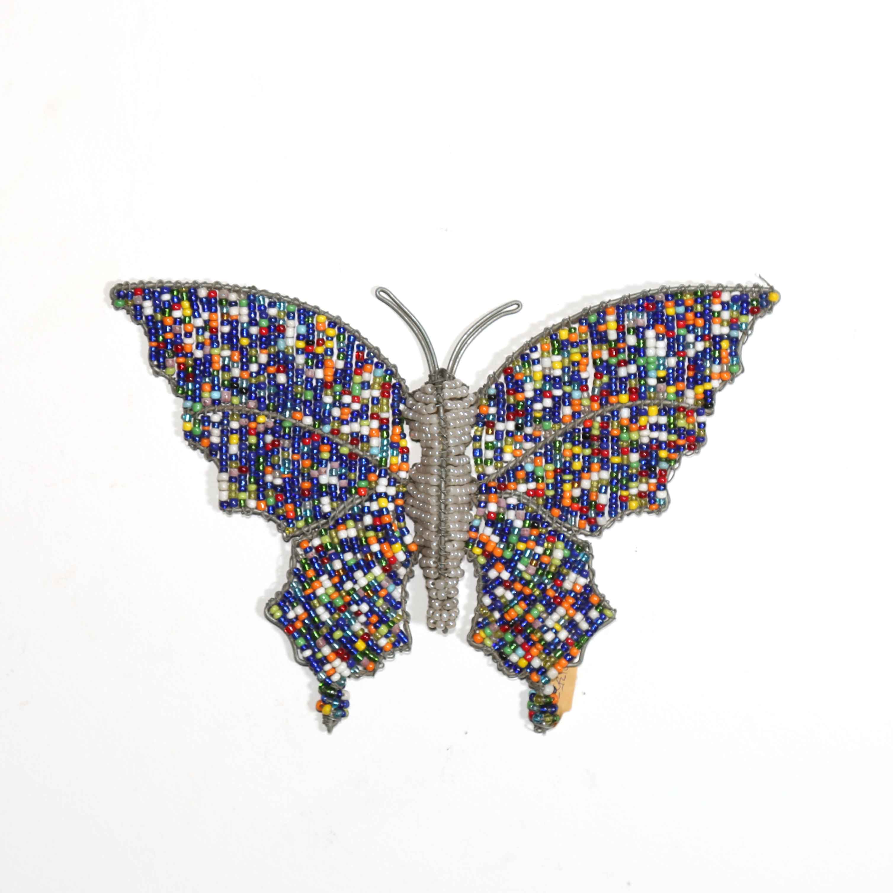 Multicolored butterfly-shaped wall hanging art on a white background