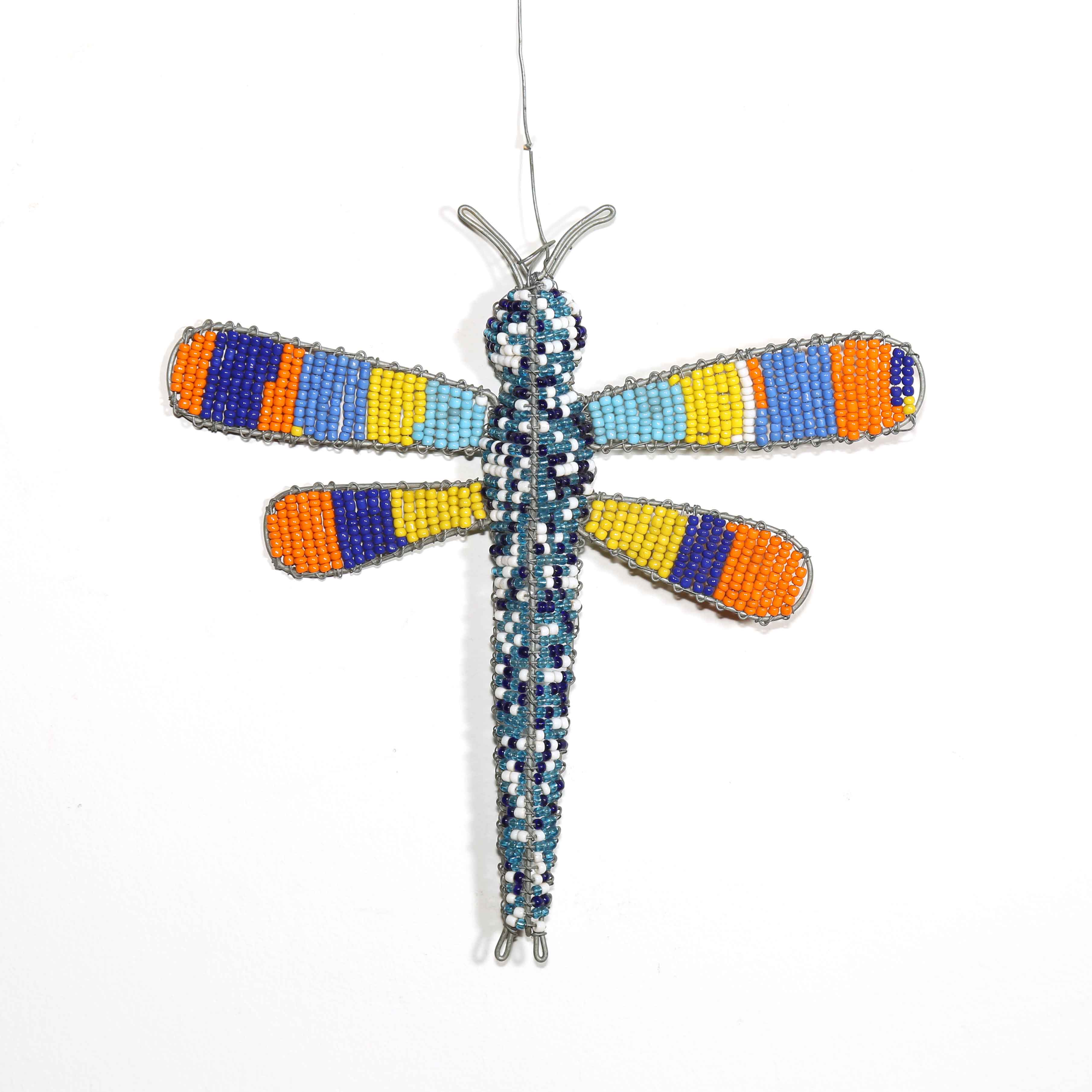 Beaded dragonfly ornament with multicolored wings on a white background