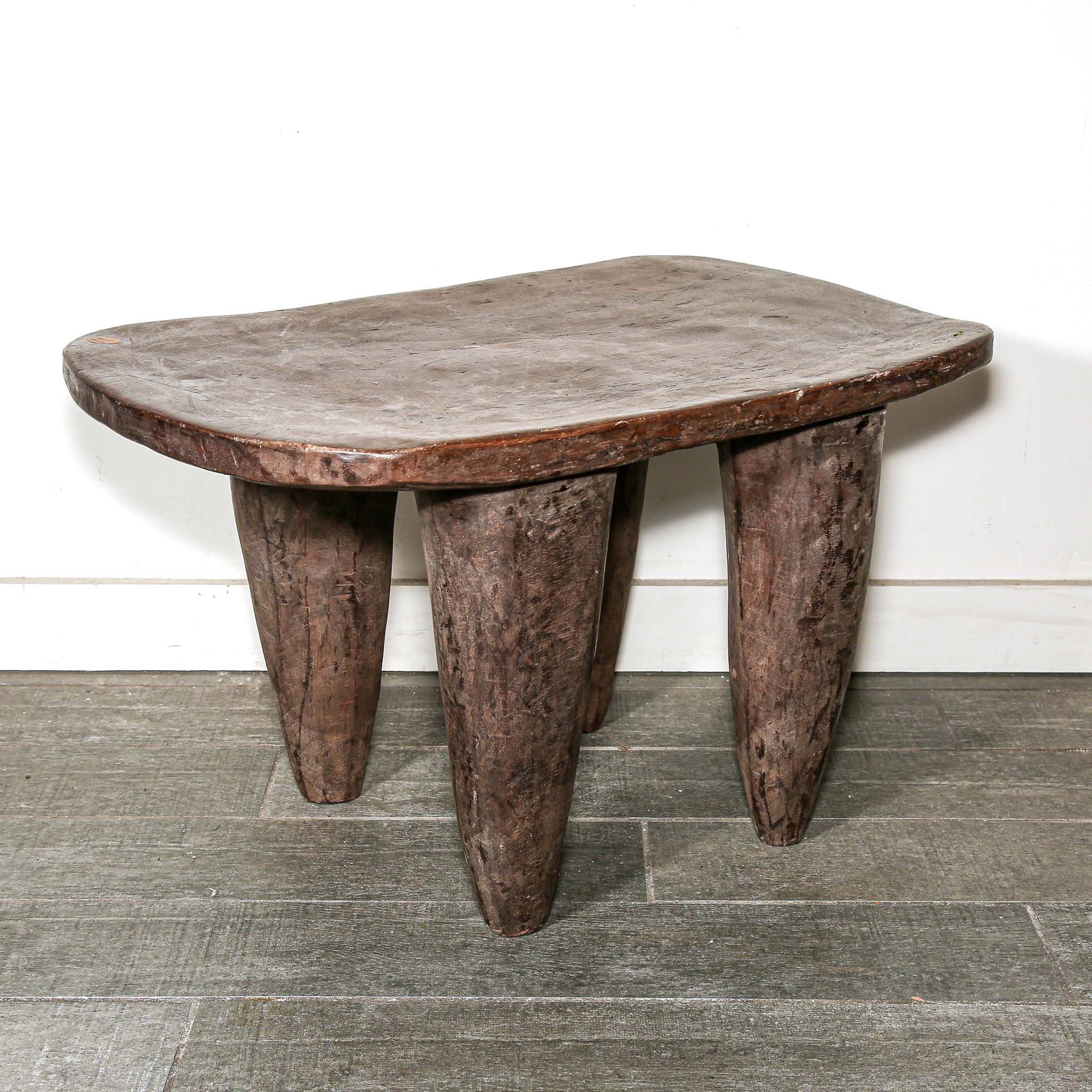 Wooden table with a natural, rustic finish from Africa with African style