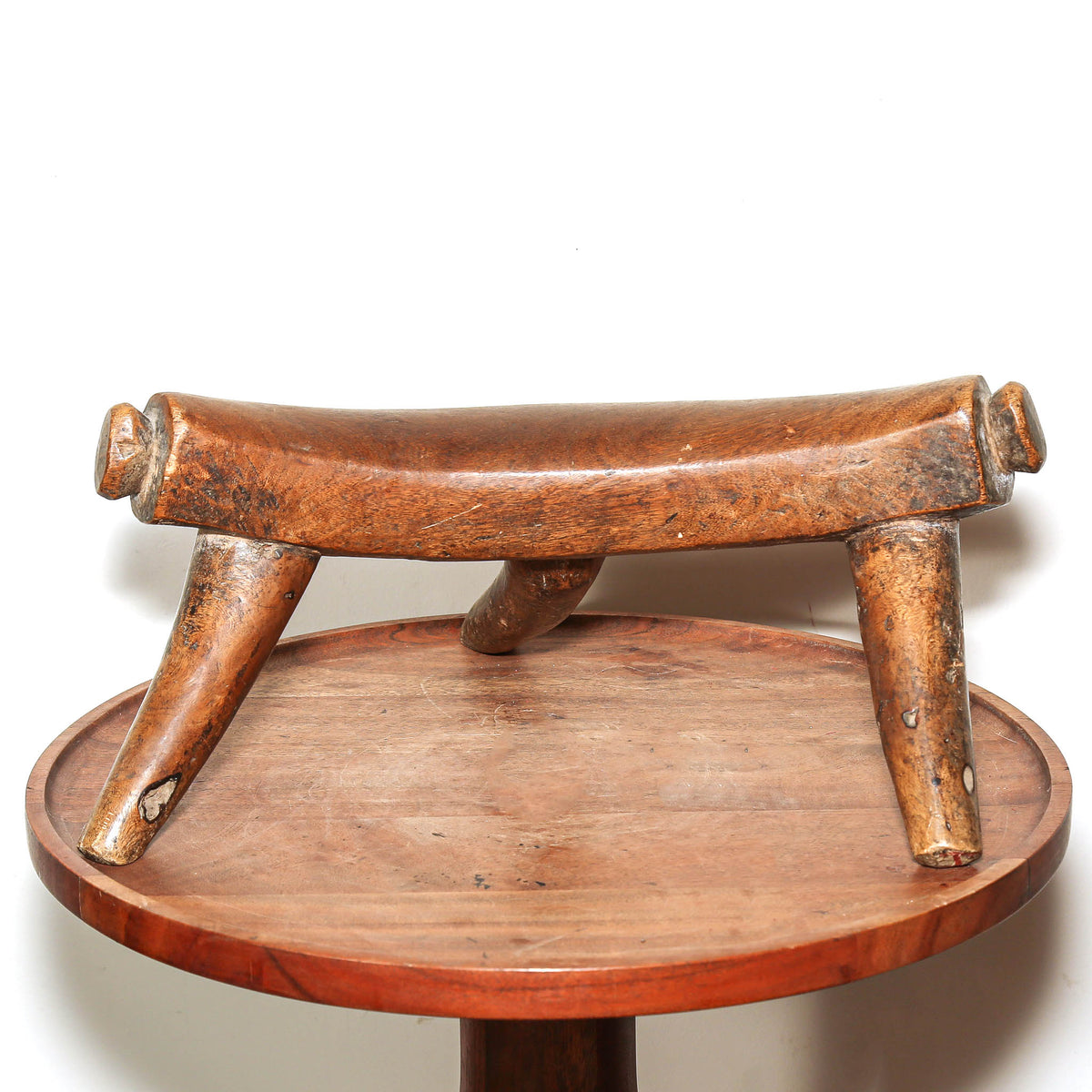 Hand-carved Dinka headrest from South Sudan with rich aged patina and sculptural form