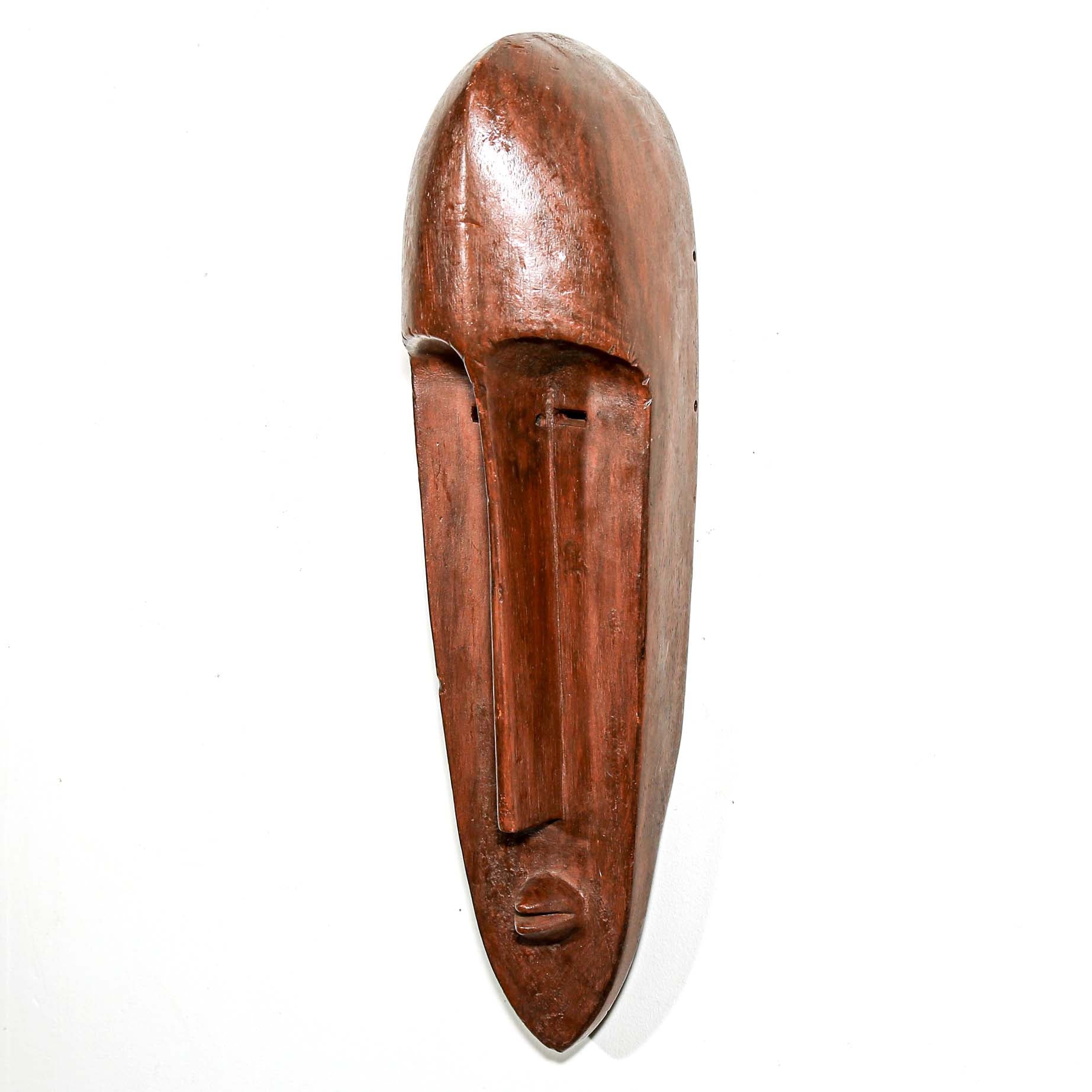 Sleek long brown Wooden mask made by African artists in Gabon to hang on your bedroom wall