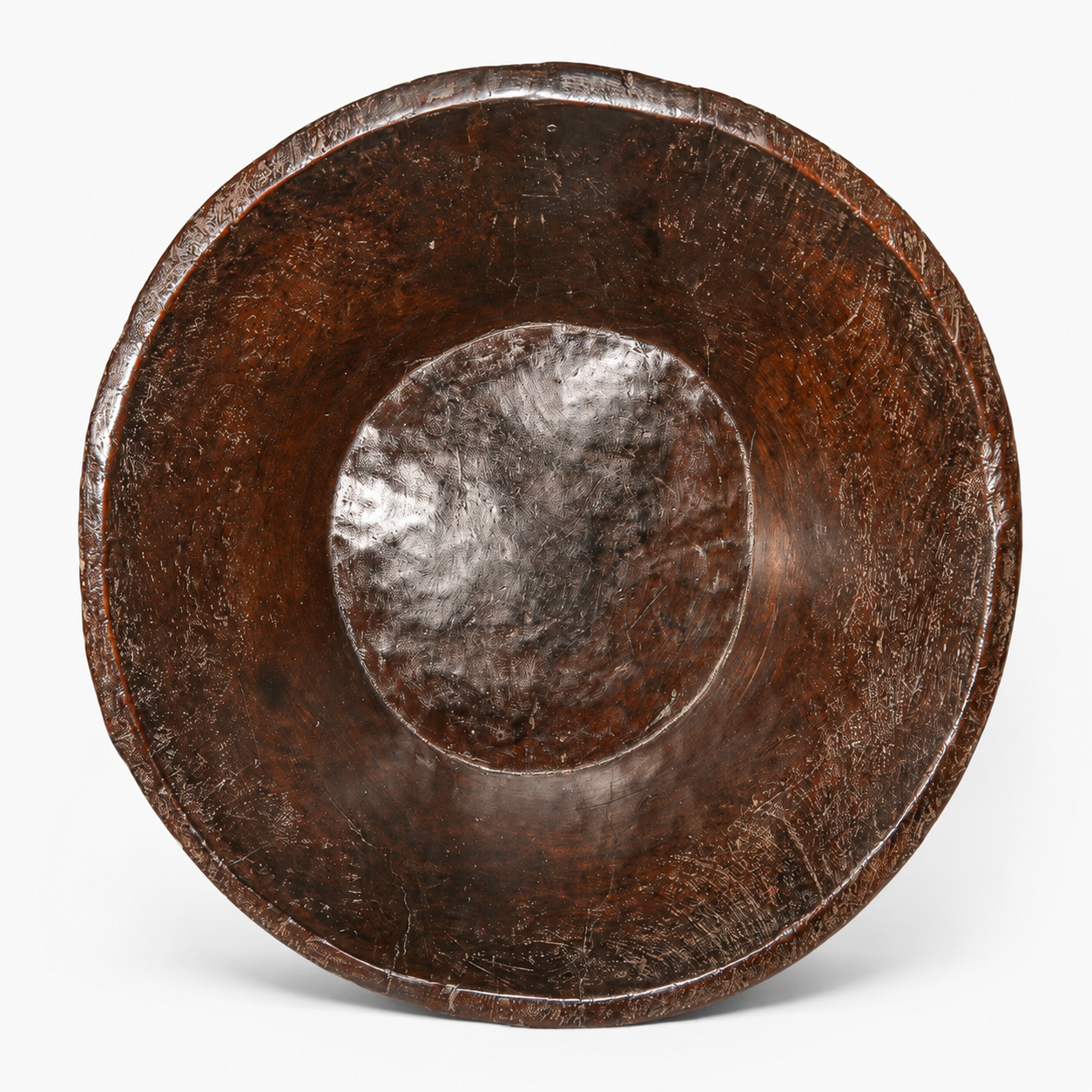Wooden bowl hand made from one piece of wood on a white background