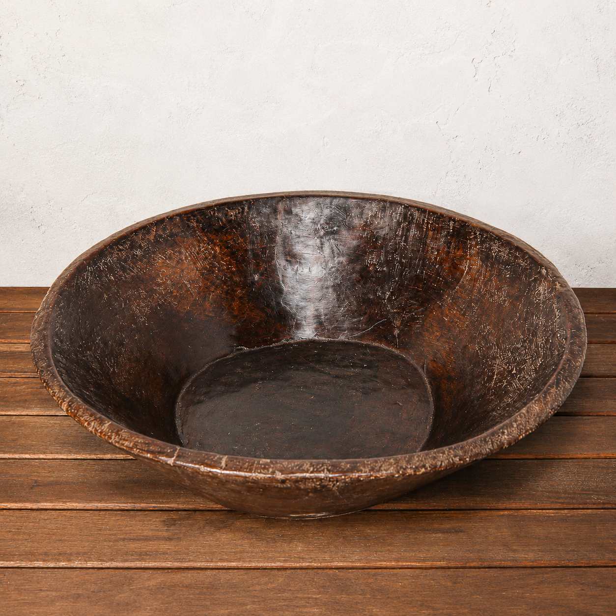 Wooden bowl hand made from one piece of wood on a white background