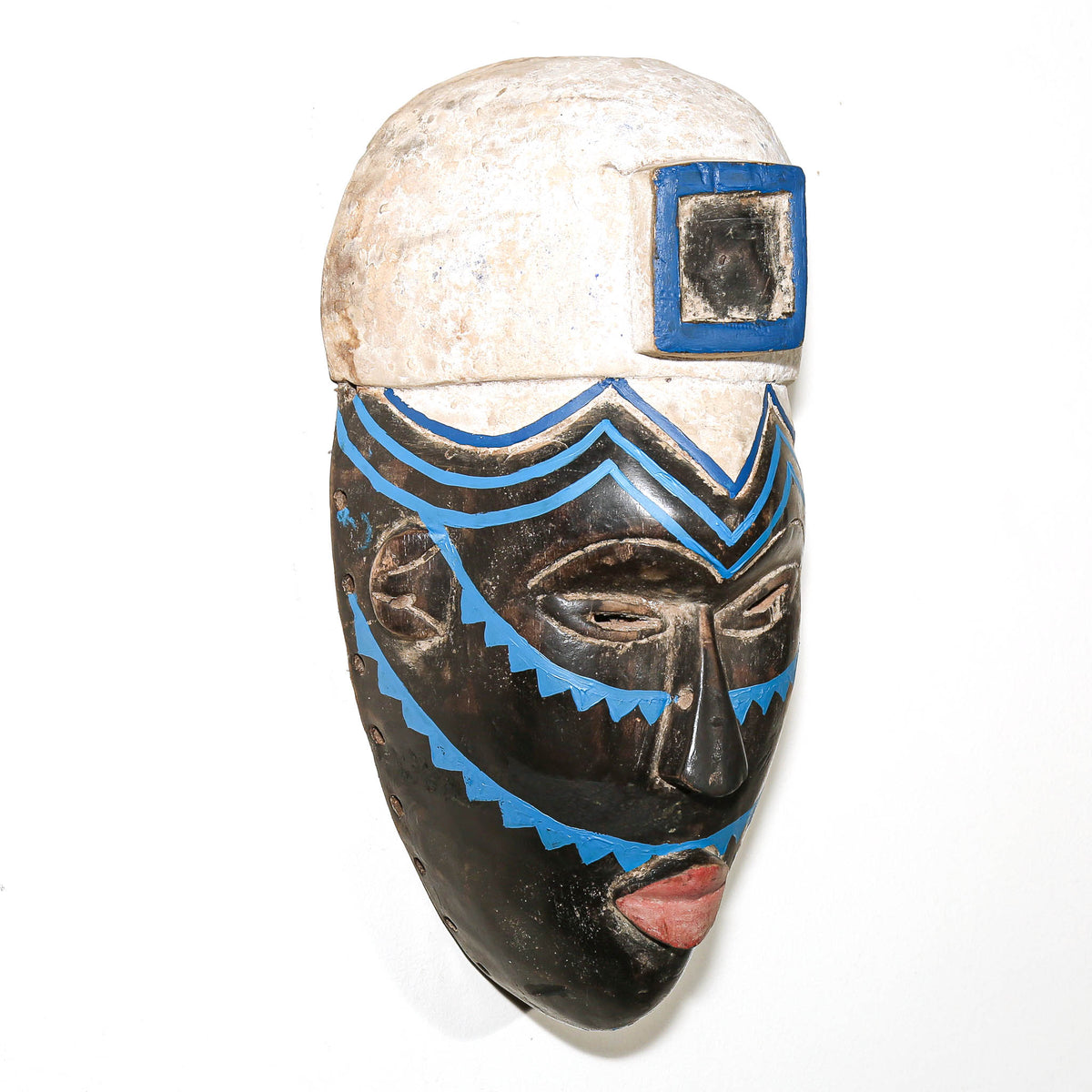 Hand-carved Igbo African mask from Nigeria featuring bold facial details and traditional ceremonial styling
